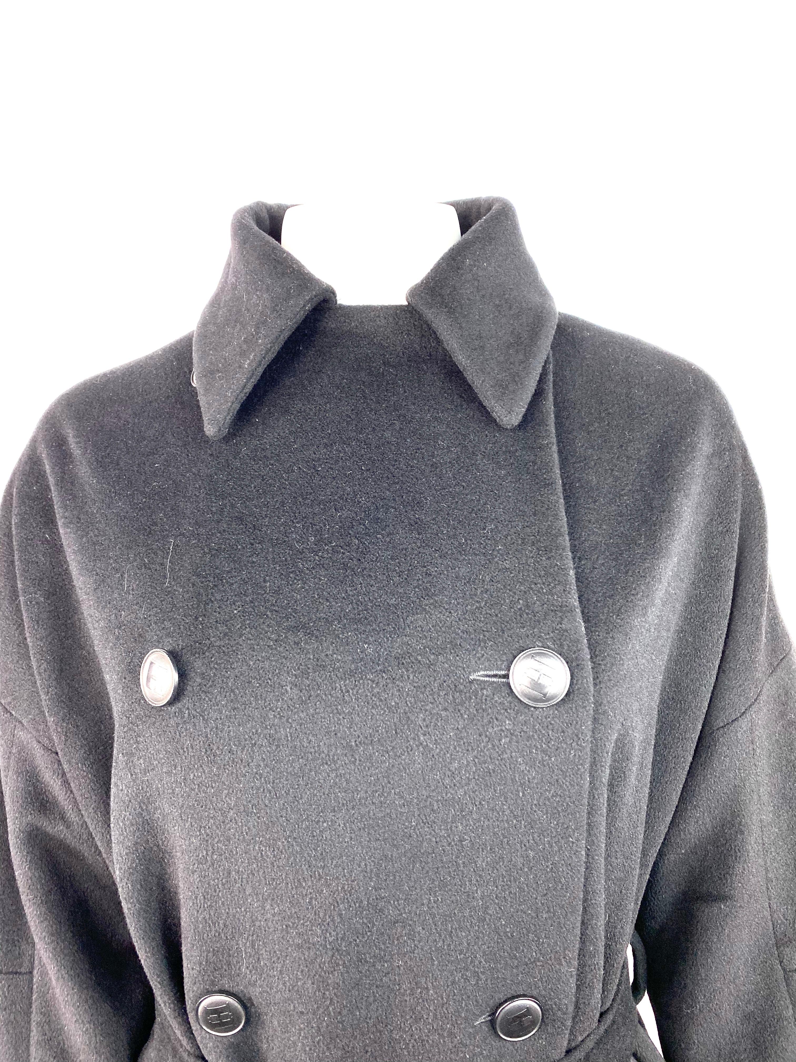 Product details:

Featuring black cashmere with collar, front eight black H stamped buttons closure, dual zipped pockets and belt detail.
Made in France.