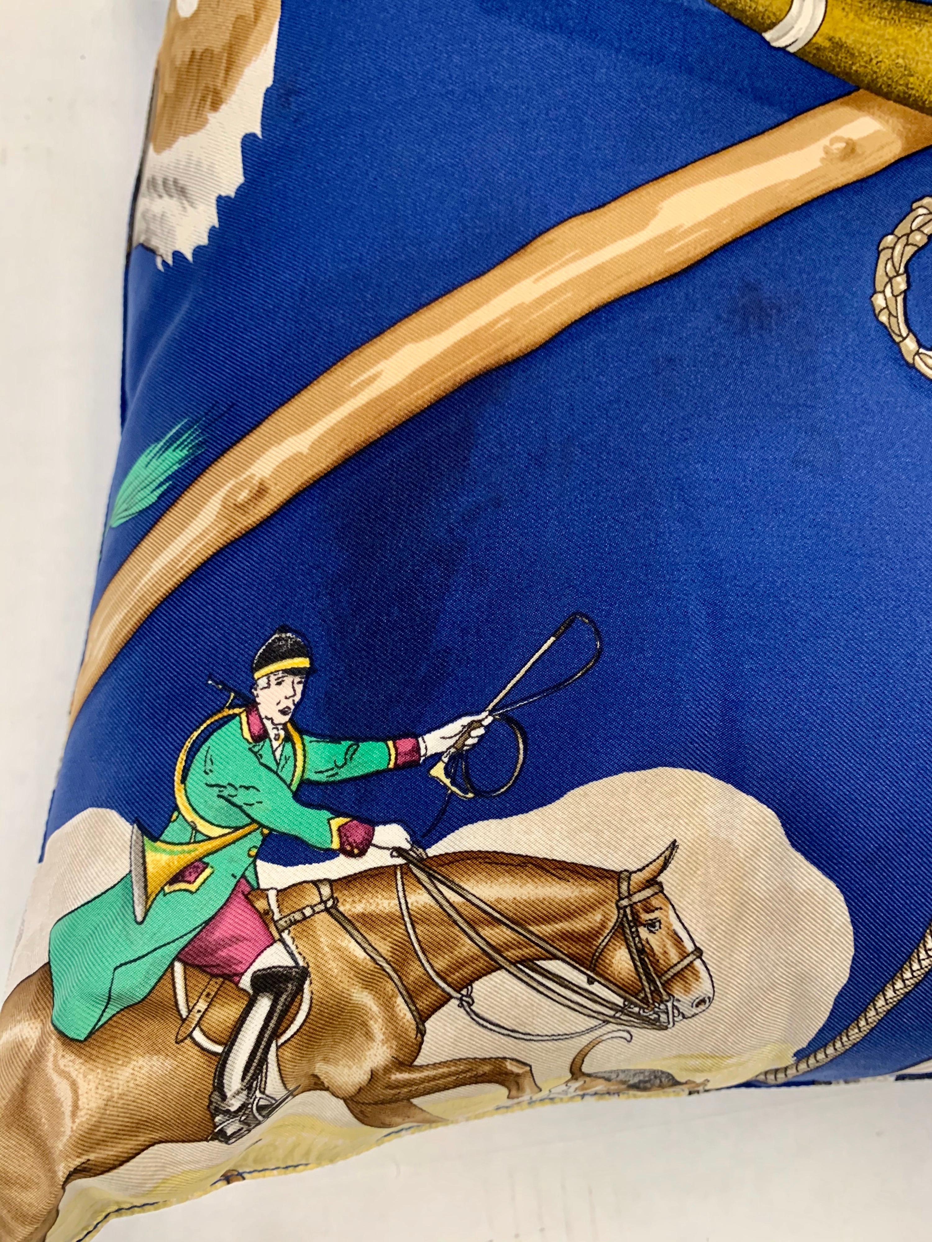 Hermès Paris blue silk scarf custom made into a pillow features a fox hunt with horses and dogs. Made in France, 100% silk. Zippered back closure.