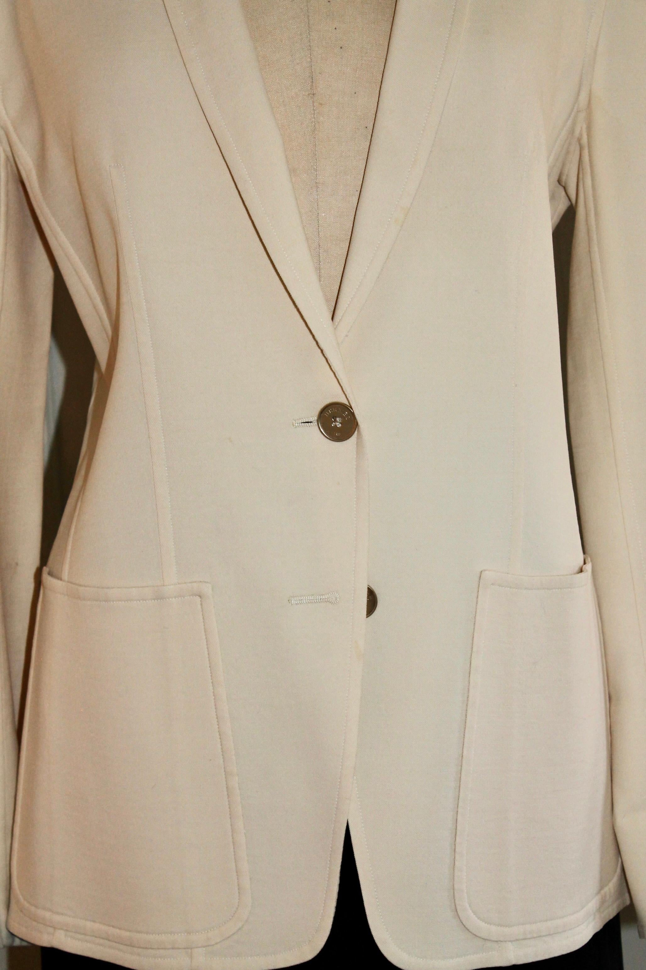 A classic Hermes cream white jacket, 96% wool and 4% lycra. EU size 44. 10 Hermes buttons.