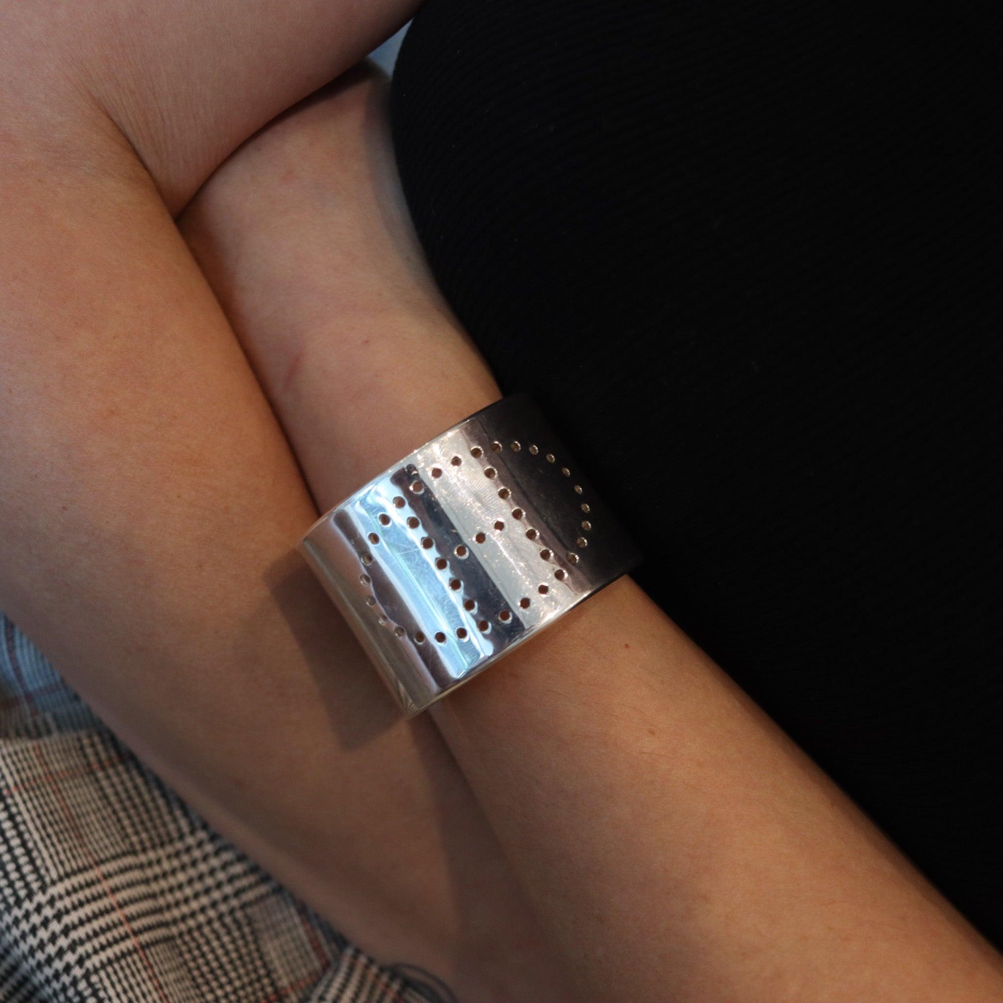 Eclypse cuff bracelet designed by Hermès.

This is a classic iconic cuff bracelet created in Paris France by the house of Hermès. This small Eclypse vintage bracelet has been crafted with the company logo of the H, in solid sterling silver of