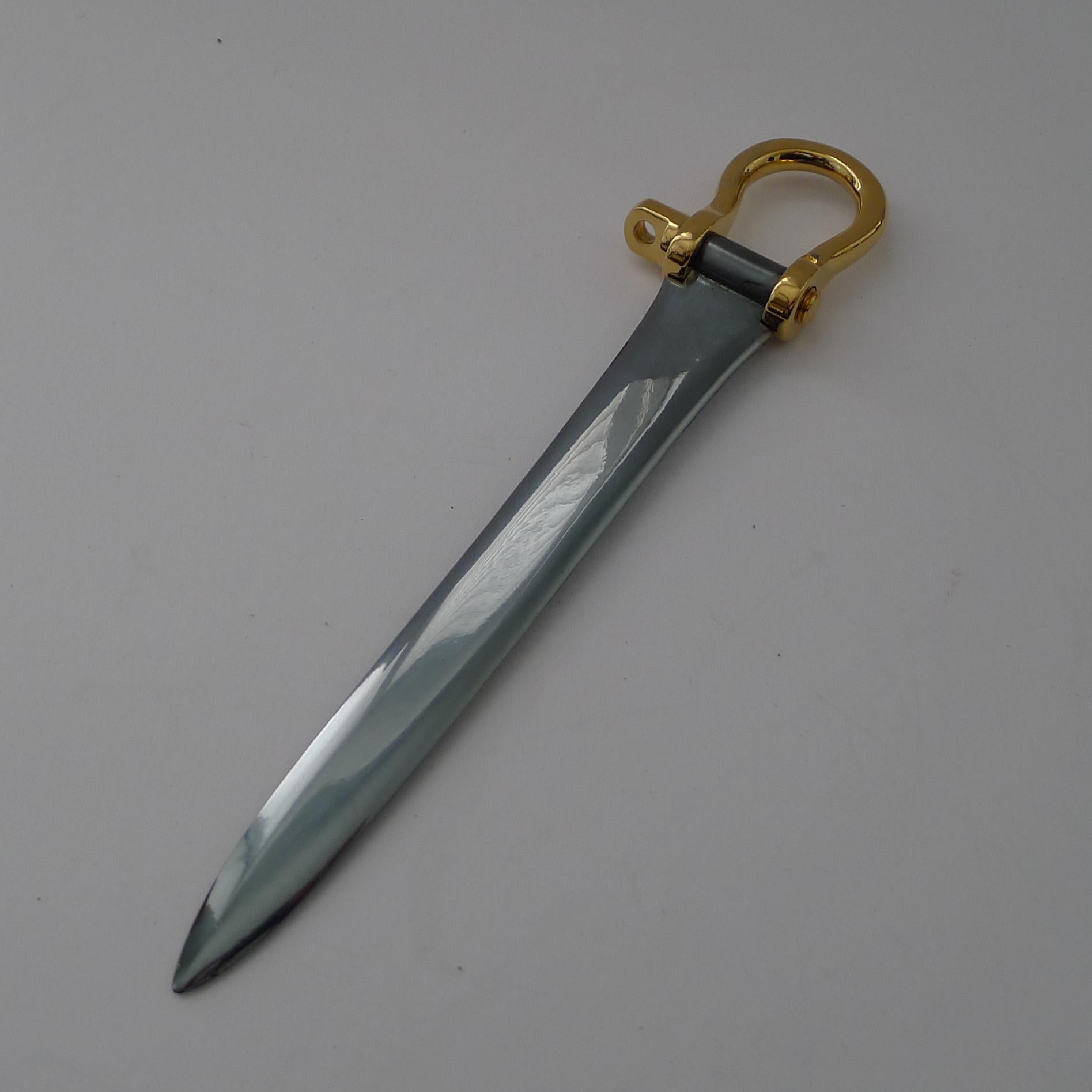 A rare vintage letter opener to adorn the finest of desktops, made from polished steel and with a gold plated horse spur handle.

Just back from my silversmith's workshop where it has been professionally cleaned and polished and the handle re-gilded