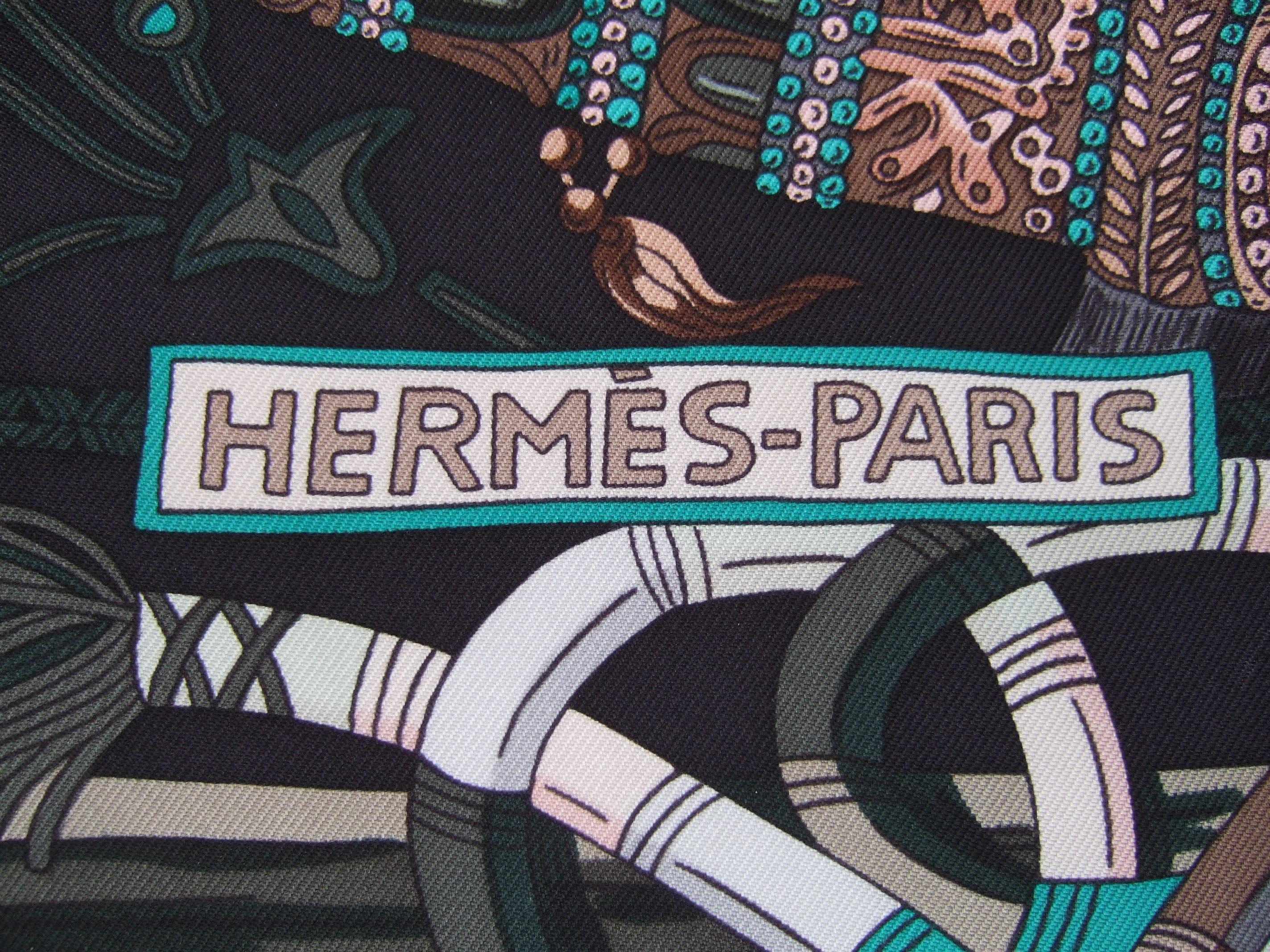 Hermes Paris Elegant silk hand rolled animal themed scarf 34.5 x 33.5 
The luxurious silk scarf is illustrated with exotic monkey's, majestic horses,
birds with schools of fish gliding through coral reefs. Accented with radiating 
sun faces

The
