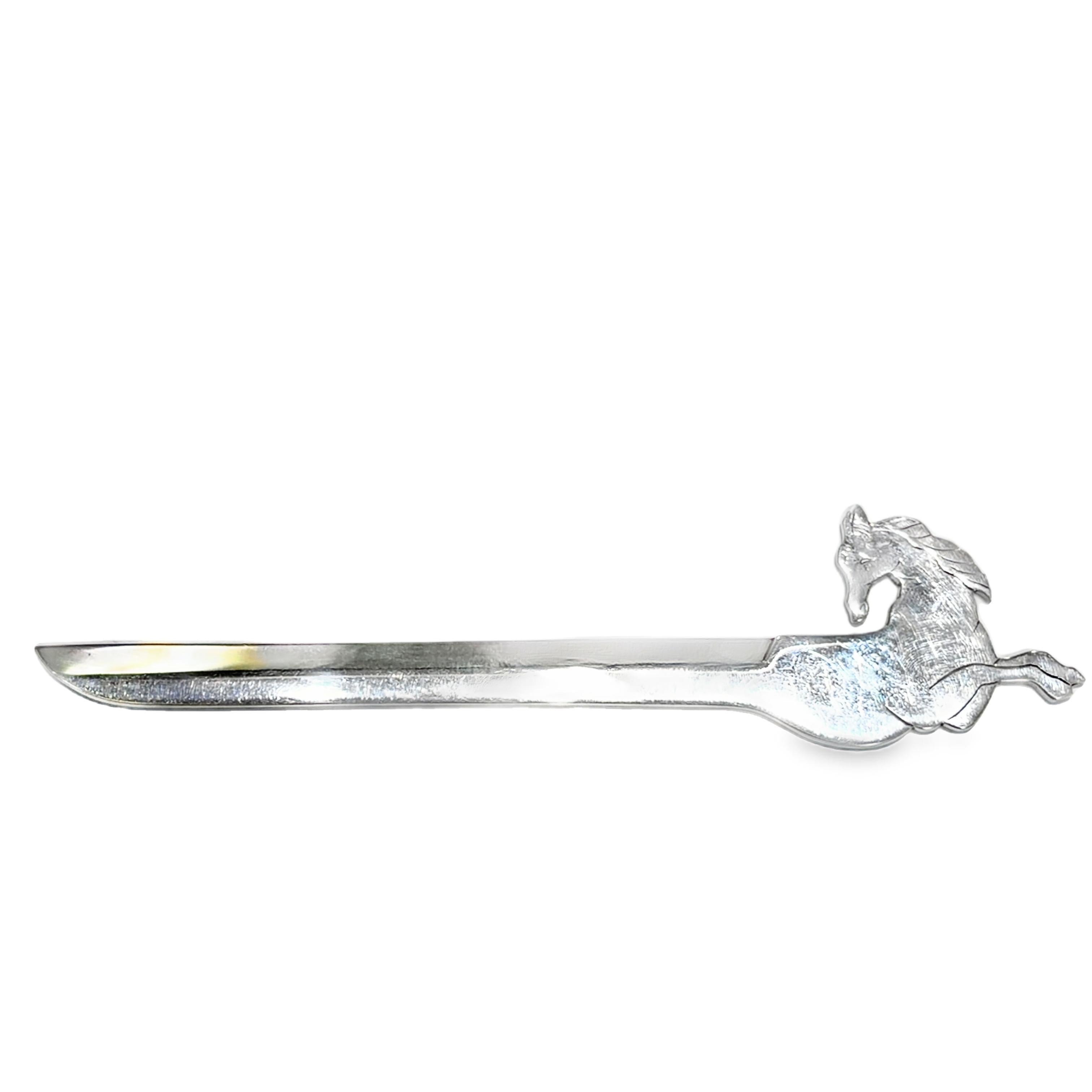 A gesture of elegance, cast in silver.

This sculptural letter opener, designed for Hermès by Ravinet Denfert circa 1970, captures the quiet power of the horse in mid-stride. Rendered in silver plate, its streamlined silhouette is crowned with a