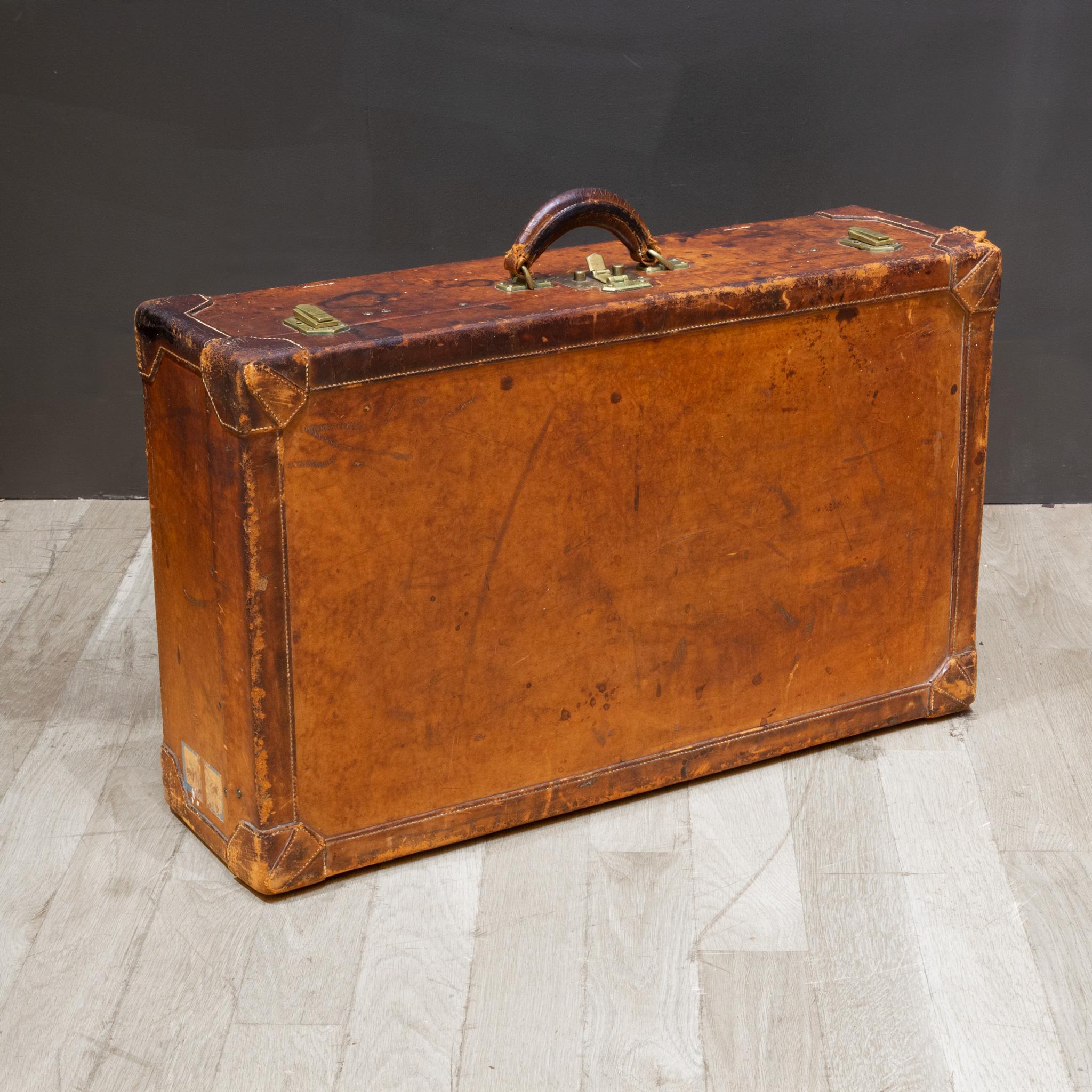 ABOUT

An original leather suitcase by Hermès with brass locks, cotton interior and leather straps. Original leather handle and leather name tag. Locks are stamped 