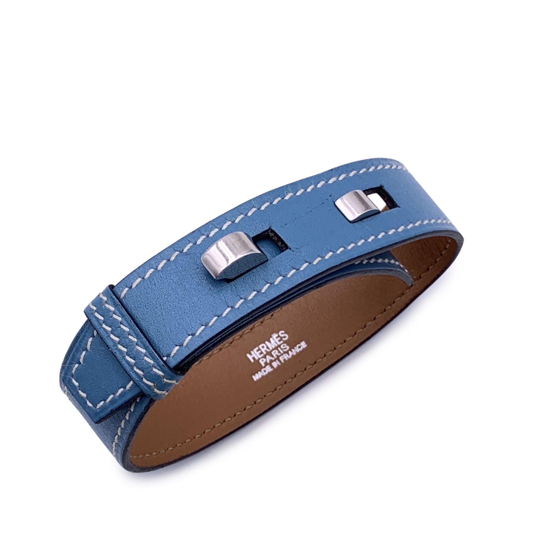 Vintage Hermes leather bracelet in blue leather. Silver metal hardware. For wrists up to 7 inches - 17.8 cm in circumference. 'Hermes Paris - made in France' embossed inside the bracelet. Blind stamp is a J encased in a square (year of production