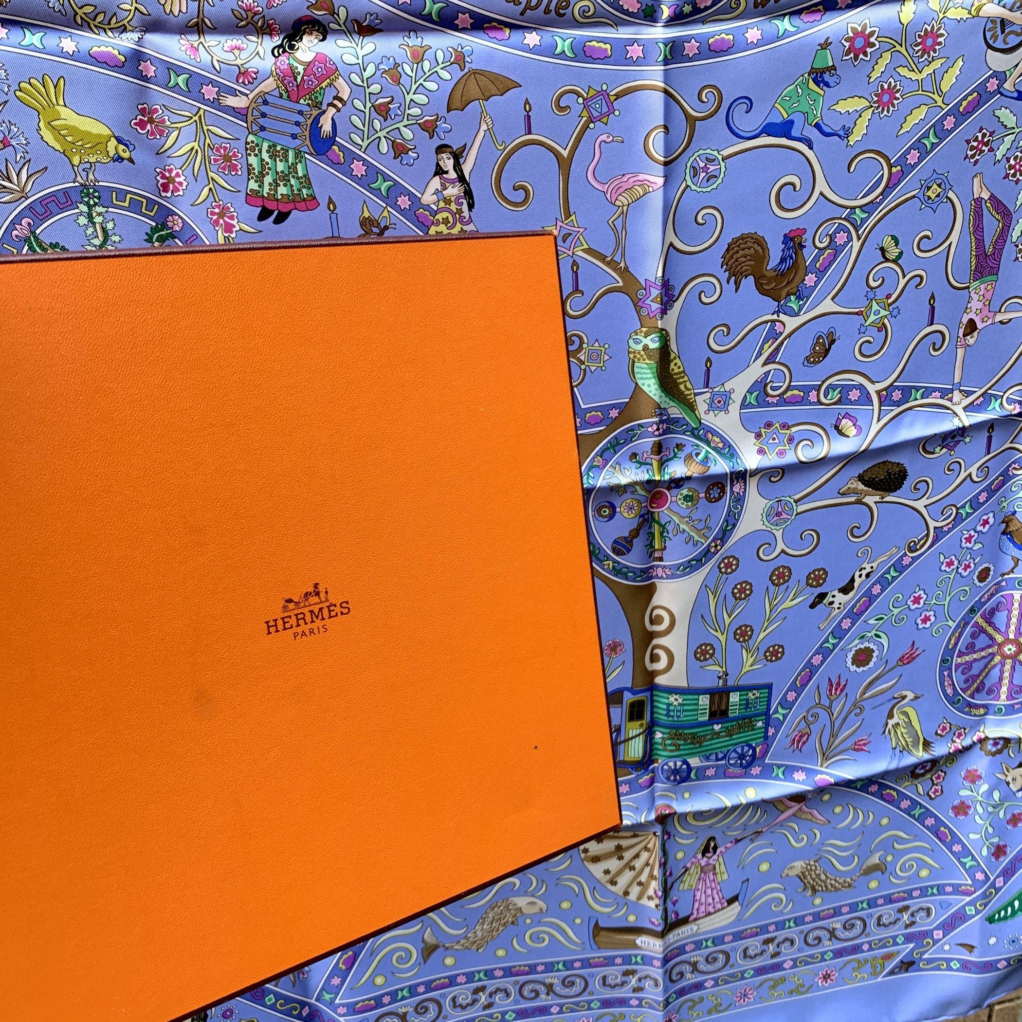Hermes Paris 'Peuple du Vent' Silk Scarf. It depicts myths and symbols of the Roman people; musicians, dancers, tightrope walkers and animals are together under the tree of life. Artist :Christine Henry. Year(s) of issue: 2009, 2014. The 'HERMES