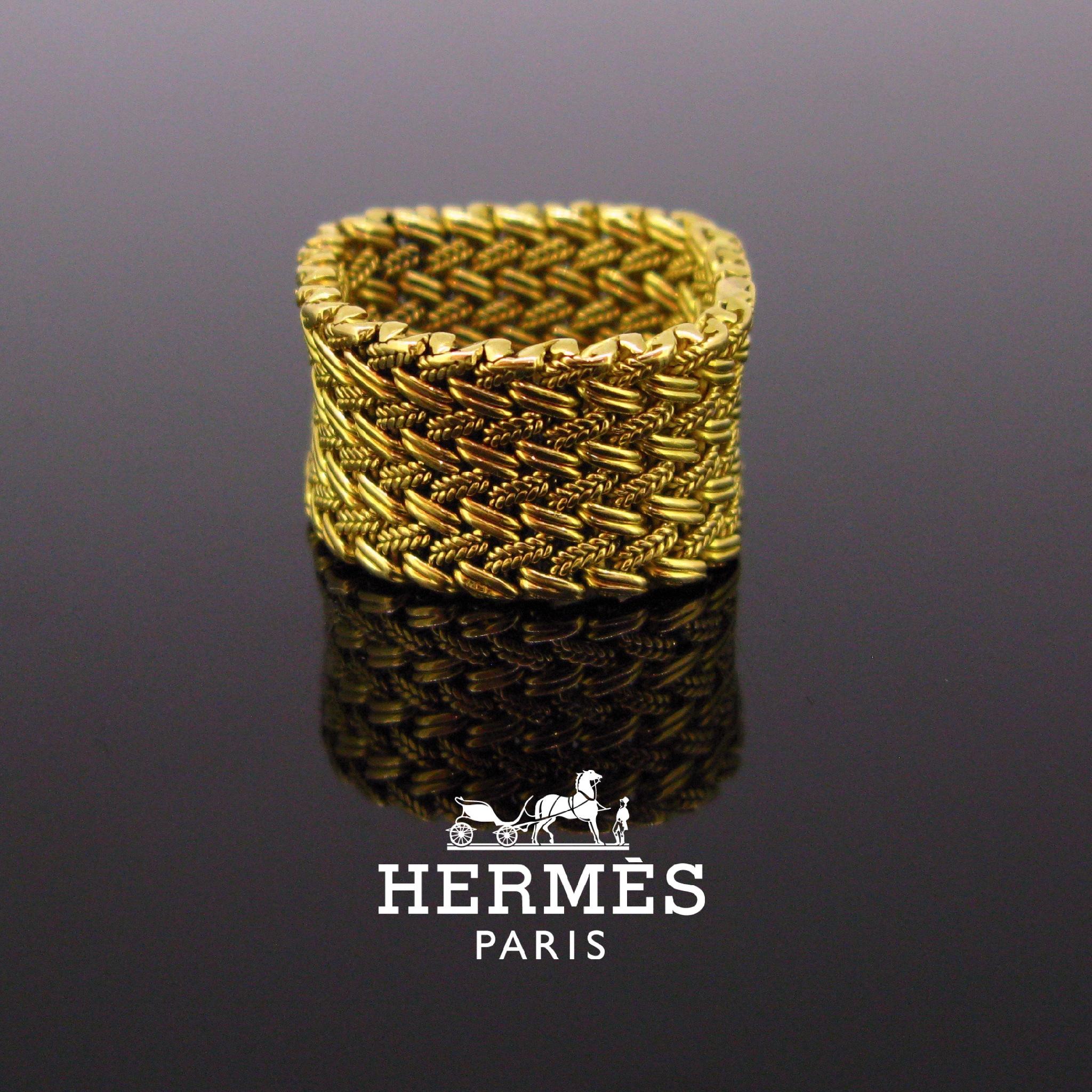 This ring is signed by the famous designer Hermes. It is made in 18kt yellow mesh gold. It is signed inside the band Hermes Paris and a serial number 31247. It is perfect for every day wear.

Weight:	12.9gr

Metal:		18kt Yellow Gold

Condition:	Very