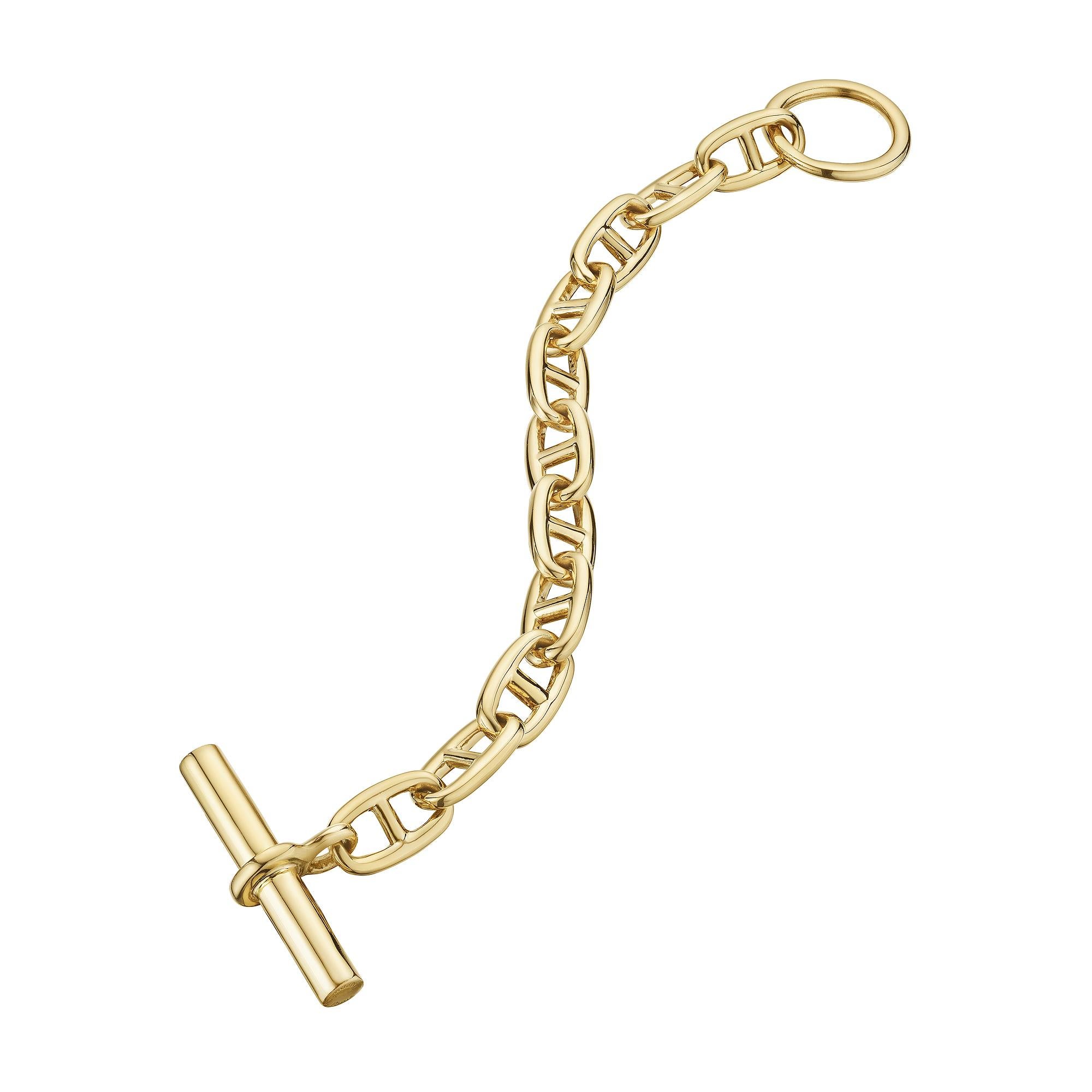 Bold and uncompromising this Hermes Paris modernist 'chaine d'ancre' toggle medium link bracelet is the statement piece you have been searching for.  With 11 links, this polished 18 karat yellow gold bracelet is extraordinarily collectible and