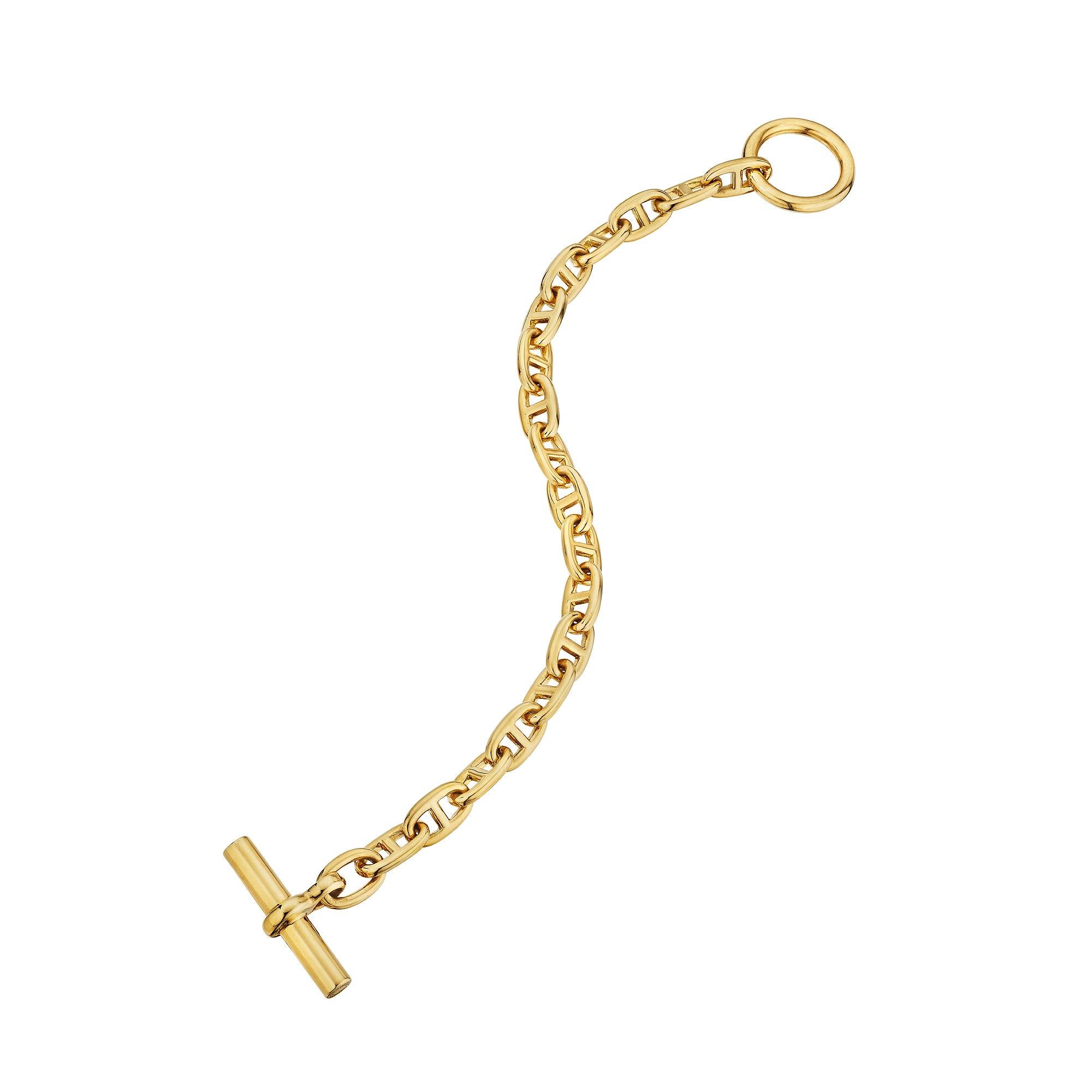 Bold and uncompromising this Hermes Paris modernist 'chaine d'ancre' small link toggle bracelet is the statement piece you have been searching for. With 17 links, this polished 18 karat yellow gold bracelet is extraordinarily collectible and utterly