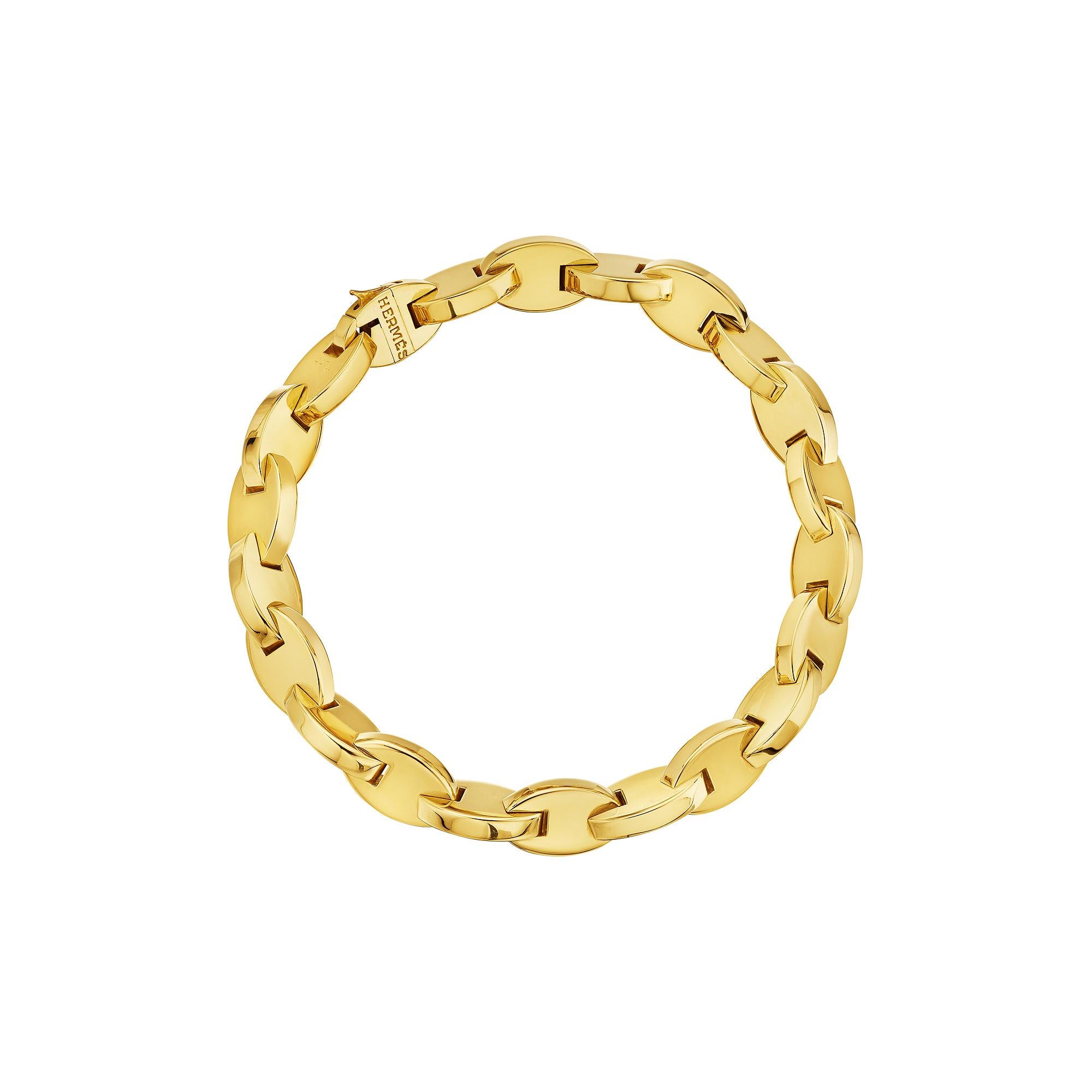 Hermes Paris modernist sleek oval link 18 karat yellow gold bracelet strongly stands alone or stacked with others but is always perfect worn everyday and everywhere.  Signed Hermes with serial number 44711.  Circa 1980-90.  7 1/2