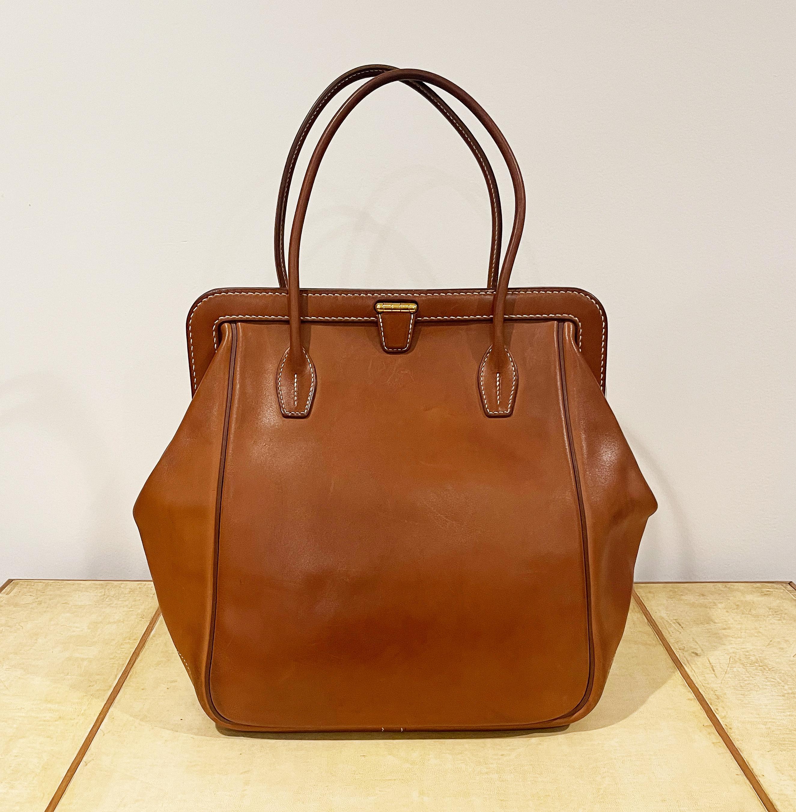 HERMES Paris, very rare Tan Barenia Calfskin Convoyeur Bag.
Limited Edition
This exquisite bag, stamped “Hermès Paris Made in France” and numbered, carries the blind stamp ‘R’ indicating its creation year as 2013. Additionally, it is marked with