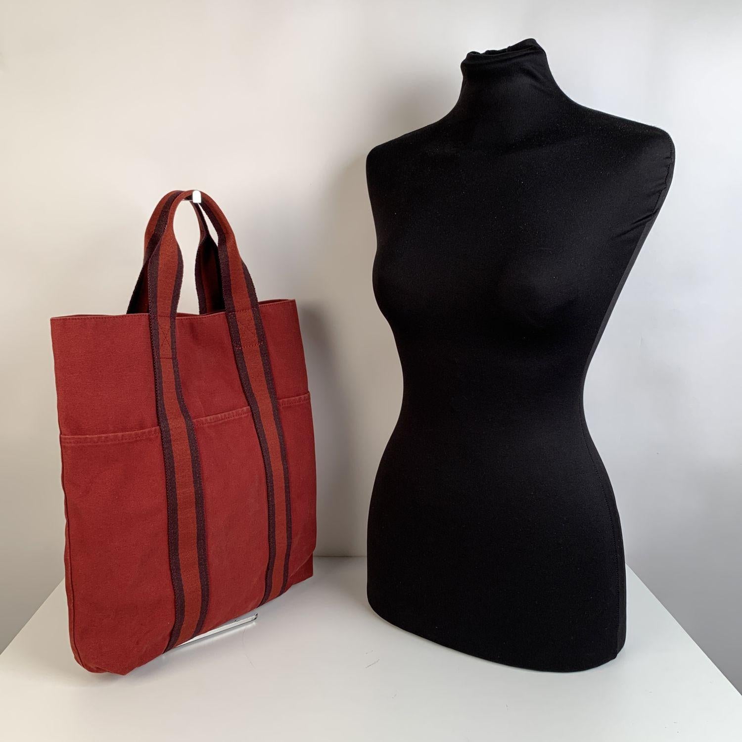 - Model: 'HERMES FOURRE TOUT ' Tote handbag. Made in France. 3 open pockets on the front. Durable canvas handles, perfect for casual and everyday use. Open top, Canvas internal lining, 1 side open pocket inside. Hermes tag