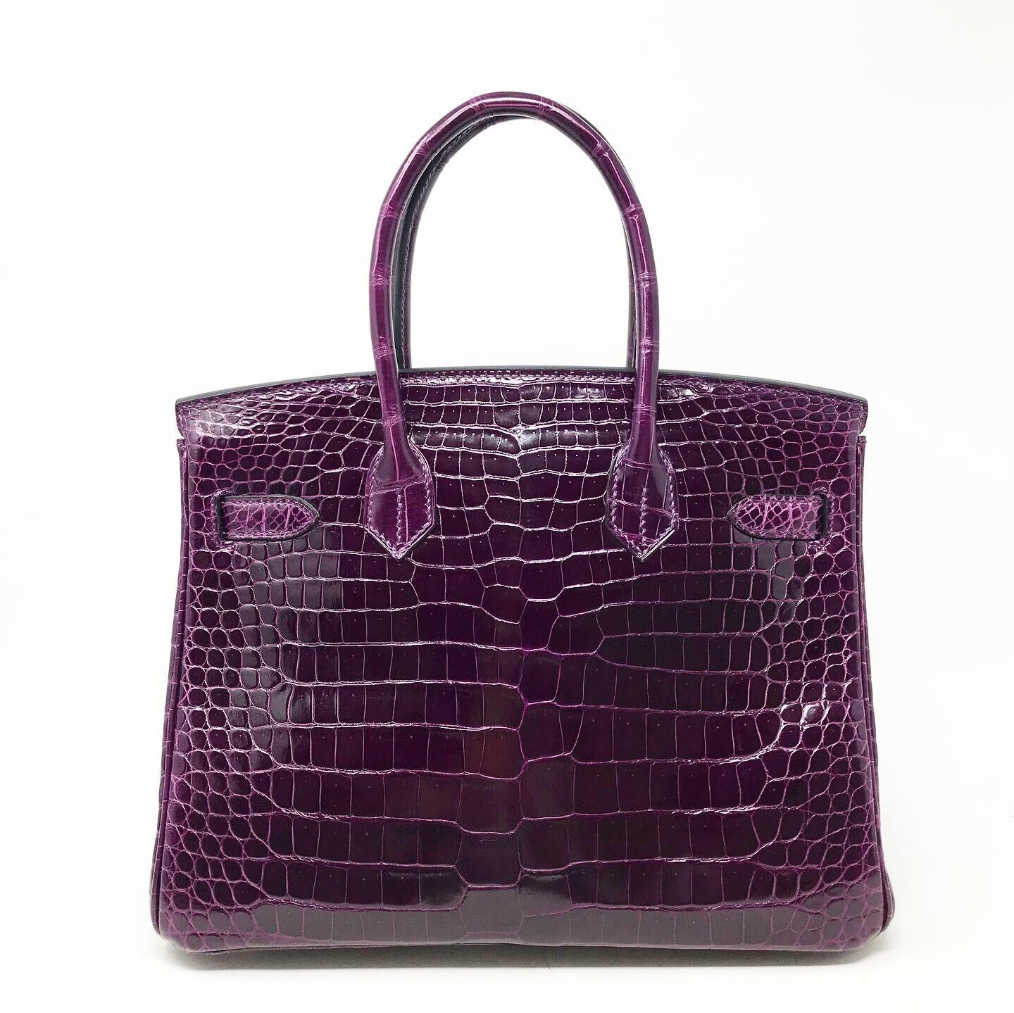 Hermès Paris Sac Birkin 30  Porosus crocodile Amethyst color Hdw silver Year of production 2012 Clochette, padlock and keys Very good condition Dust-bag included, slight signs of wear on the whole bag in excellent condition. 
