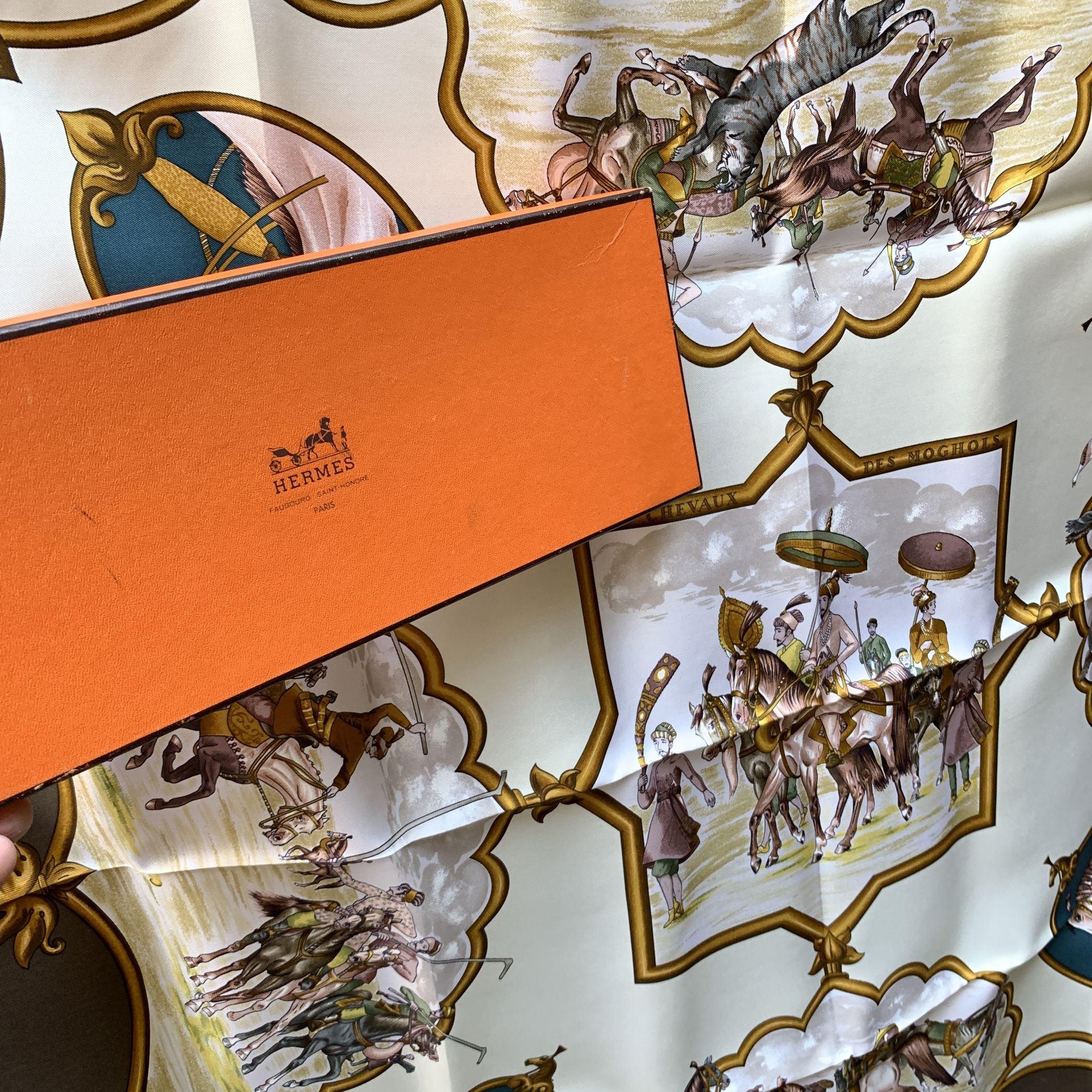 Hermes Paris Silk Scarf 'Les Chevaux de Moghols'. It depicts Mongol horsemen chaperoning their Emperor across the steppes of Central Asia. Artist : Jean De Fougerolle. Year(s) of issue: 1993, 1997/98, 2000, 2005, 2006. The 'HERMES Paris' is located