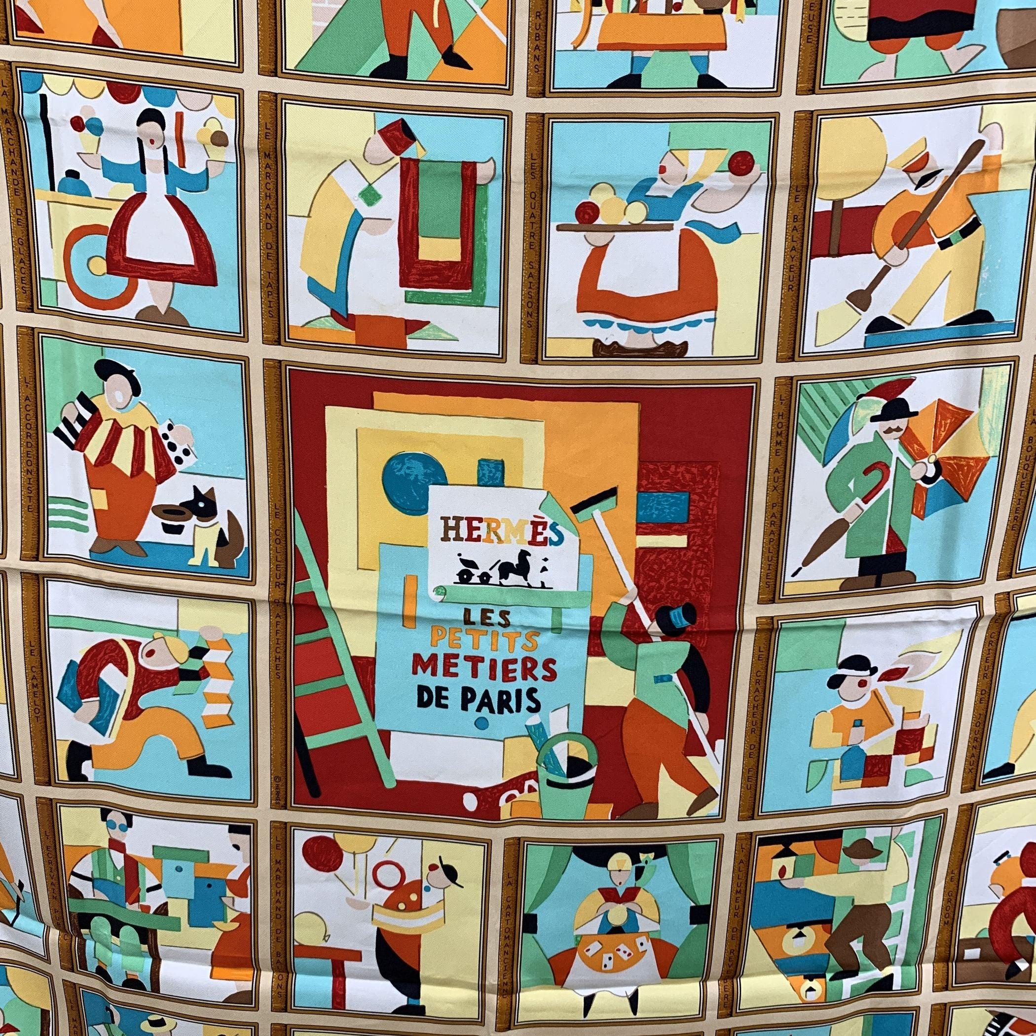 HERMES Silk scarf named 'Les Petits Métiers de Paris ', created by artist Karen Petrossian, and first issued in 2006. It depicts different types of tradesmen of Paris. Multicolor design with orange borders. 100% Silk. Hand rolled edges. Approx