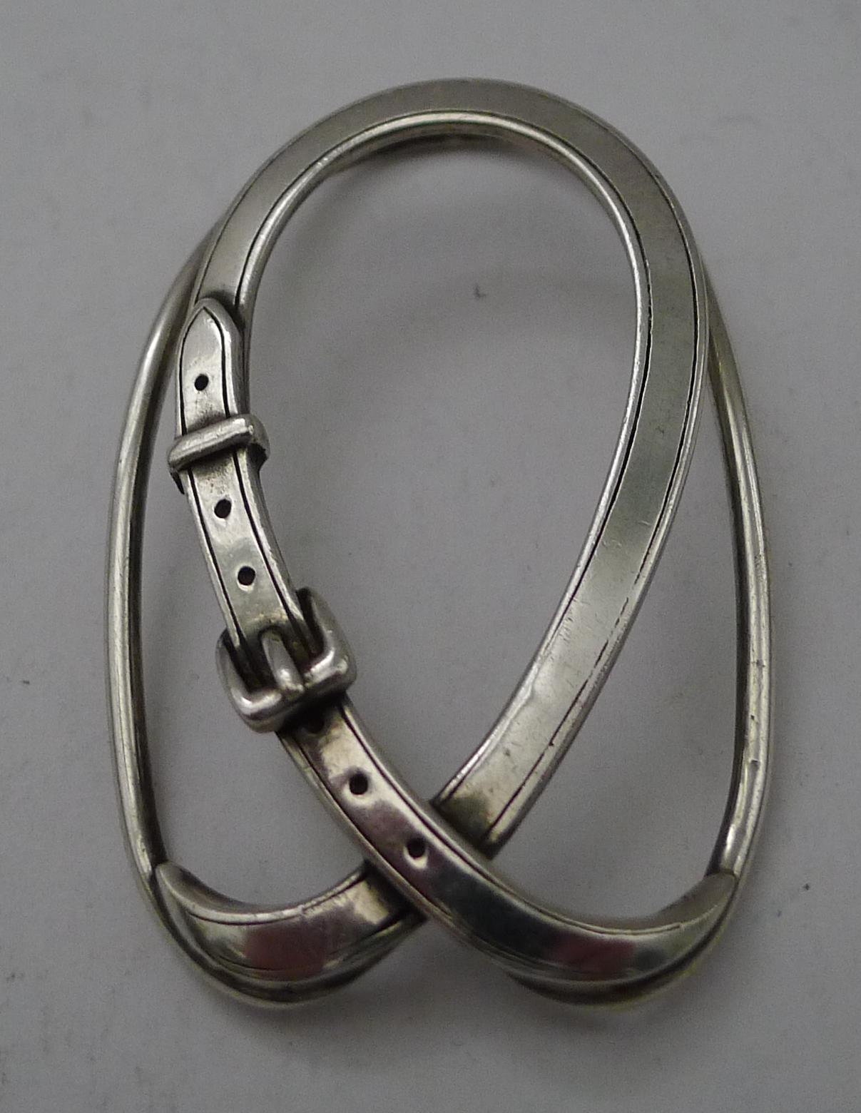 A wonderful solid silver 800 money clip, perfect for Money, desk-top papers or business cards; in the form of a belt and fully marked with silver hallmarks and signed on the underside, Hermes, Paris.

Dating to c.1980, it remains in excellent