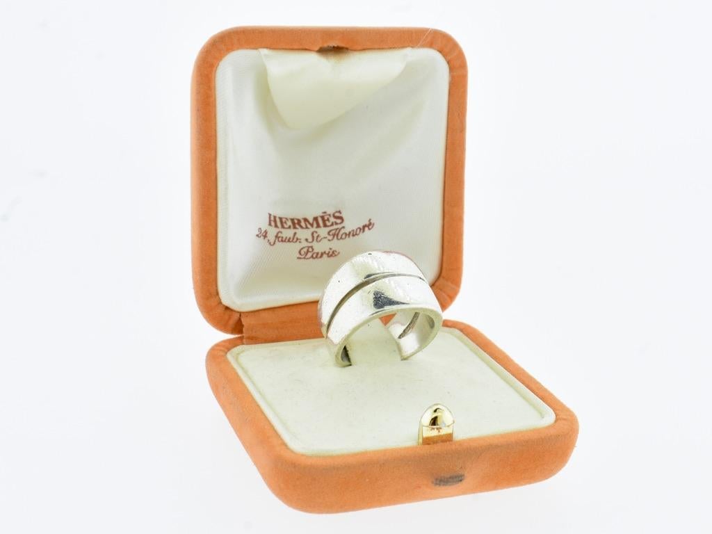 Hermes Paris sterling silver heavy vintage ring.  Signed Hermes with a DP in a cartouche which is probably the maker of the ring for Hermes, this wide double crossover band ring has a substantial weight of 12.2 grams.  It is an American size 5 3/4,