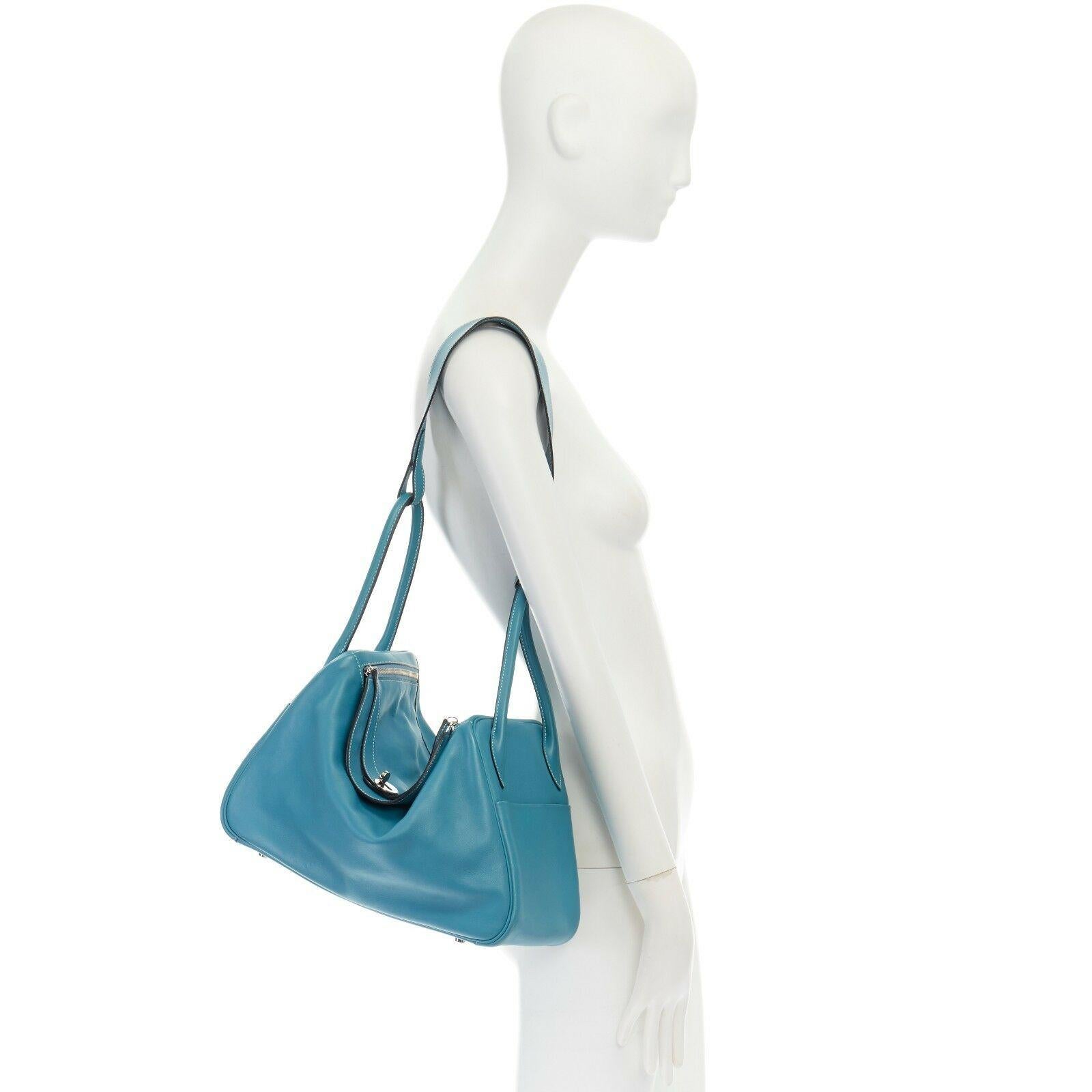HERMES PARIS Swift Lindy 30 palladium silver hardware dual strap shoulder bag Reference: LNKO/A00916 
Brand: Hermes 
Model: Lindy 30 
Material: Leather 
Color: Blue 
Pattern: Solid 
Closure: Zip 
Extra Detail: Lindy 30. Swift leather. Contrast white
