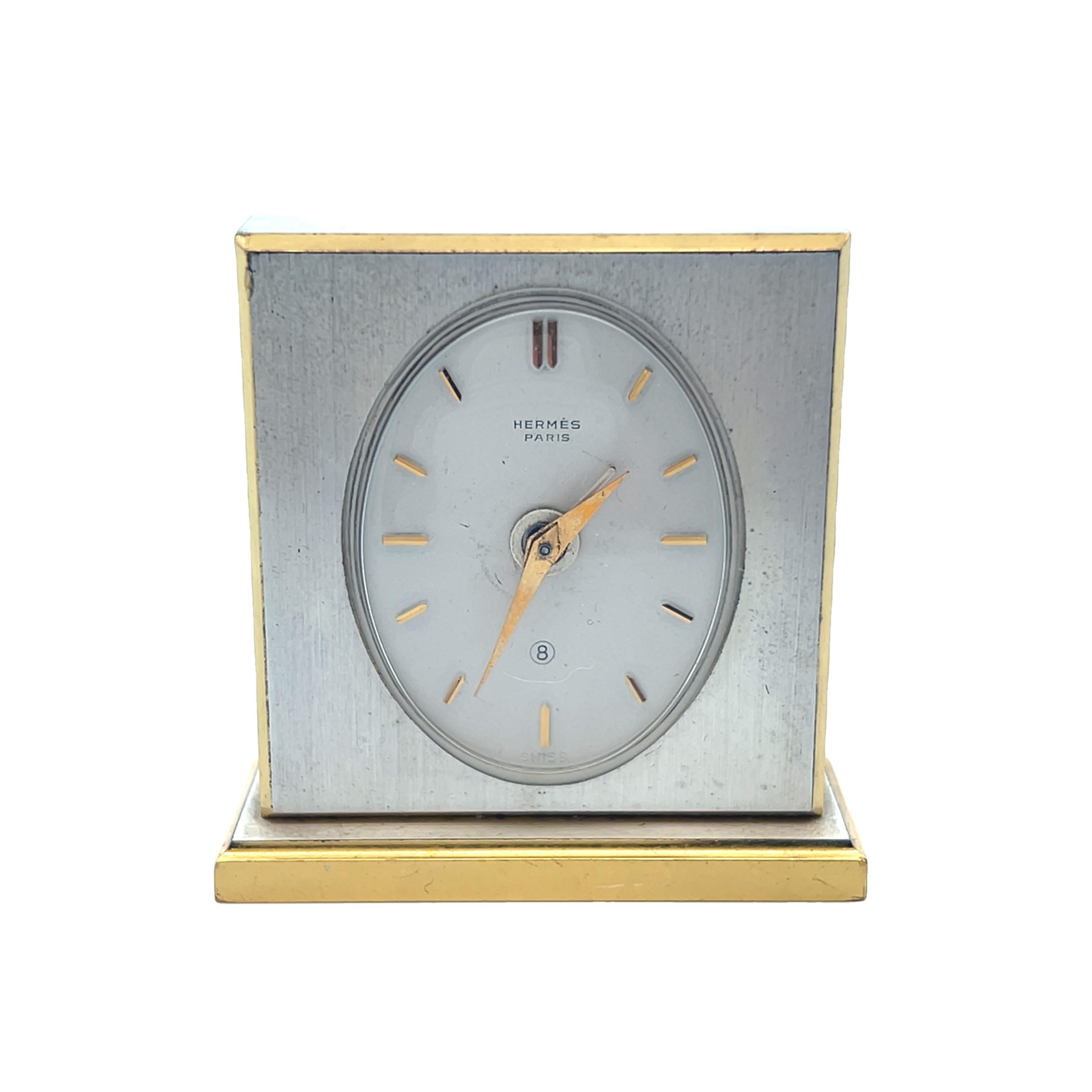 This incredible travel clock was retailed by Hermes Paris and comes with the original brown Hermes travel case. The clock has a nice hefty weight that ensures the clock will not tip and fall over when you set it across different surfaces around the