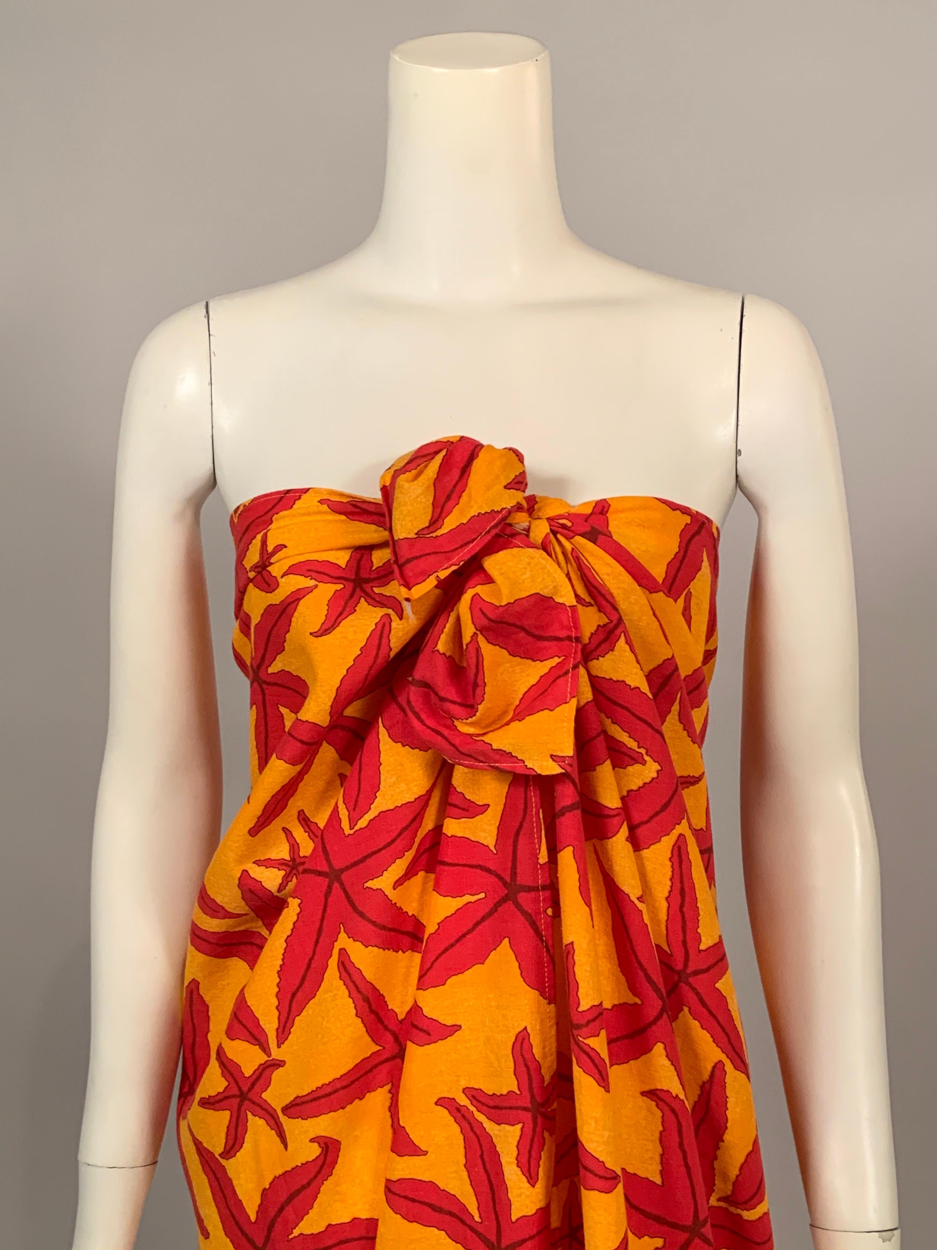 Bright and cheerful starfish of many sizes in red are swimming across a sunny yellow background in this pareo or shawl from Hermes, Paris. It is a blend of cotton, linen and silk. The Hermes label is sewn to one corner of the shawl and it is in