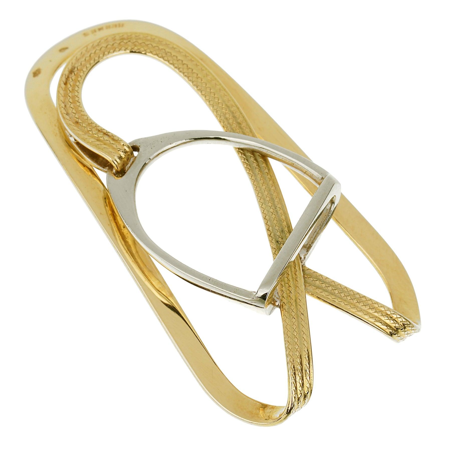 Cette pince à billets distinguée est fabriquée à partir d'or jaune et d'or blanc 18 carats, alliant l'éclat chaleureux de l'or jaune à la brillance sophistiquée de l'or blanc. Le mélange harmonieux de ces deux métaux précieux crée un contraste