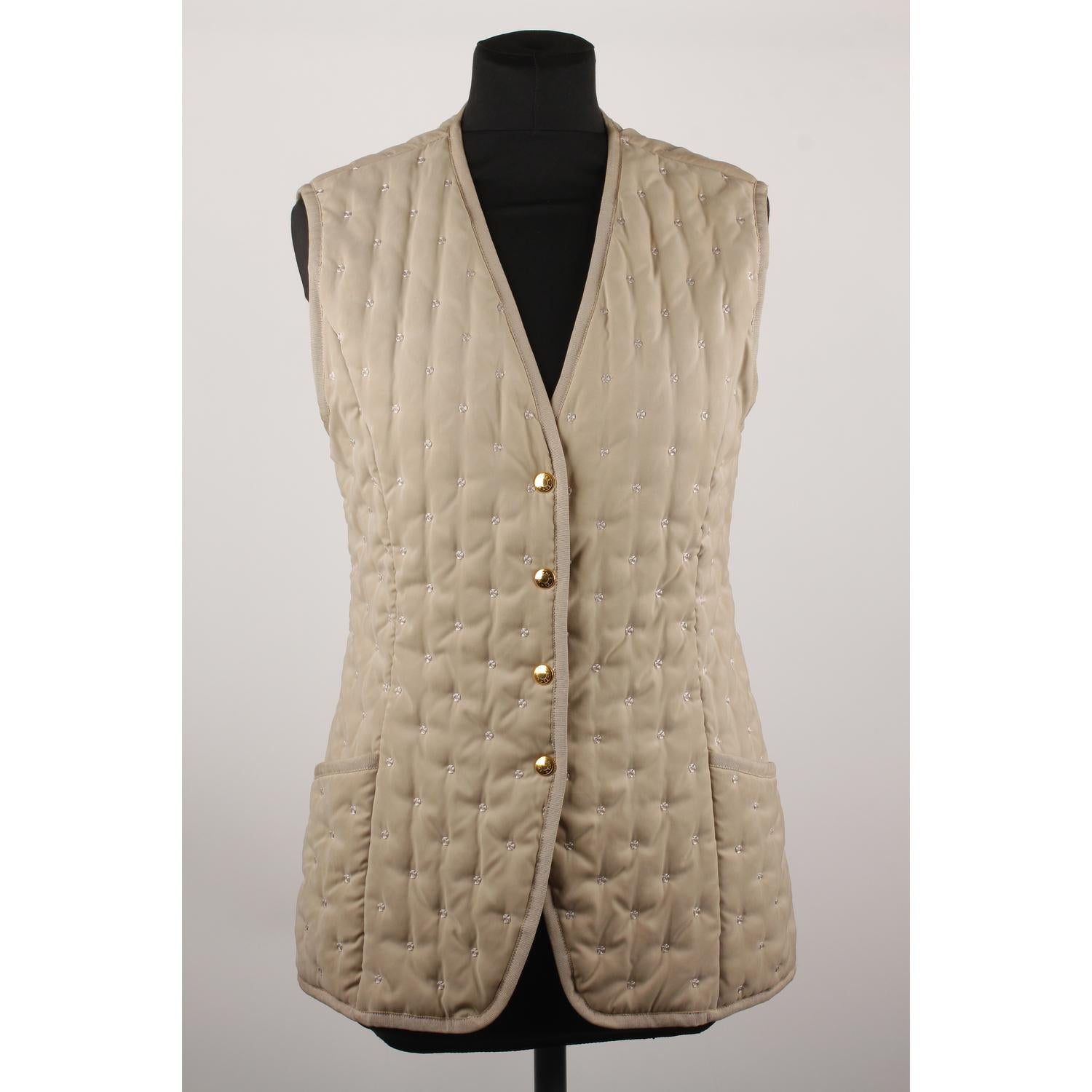 Hermes Paris Vintage Beige Embroidered Padded Vest Size 38

Model: Vest
Material: Cotton
Color: Beige 
Gender: Women
Country of Manufacture: France
Size: Small
TOTAL LENGTH: 26 inches - 66,1 cm  (from shoulder to hem)
SLEEVE LENGTH: - 
BUST: 17