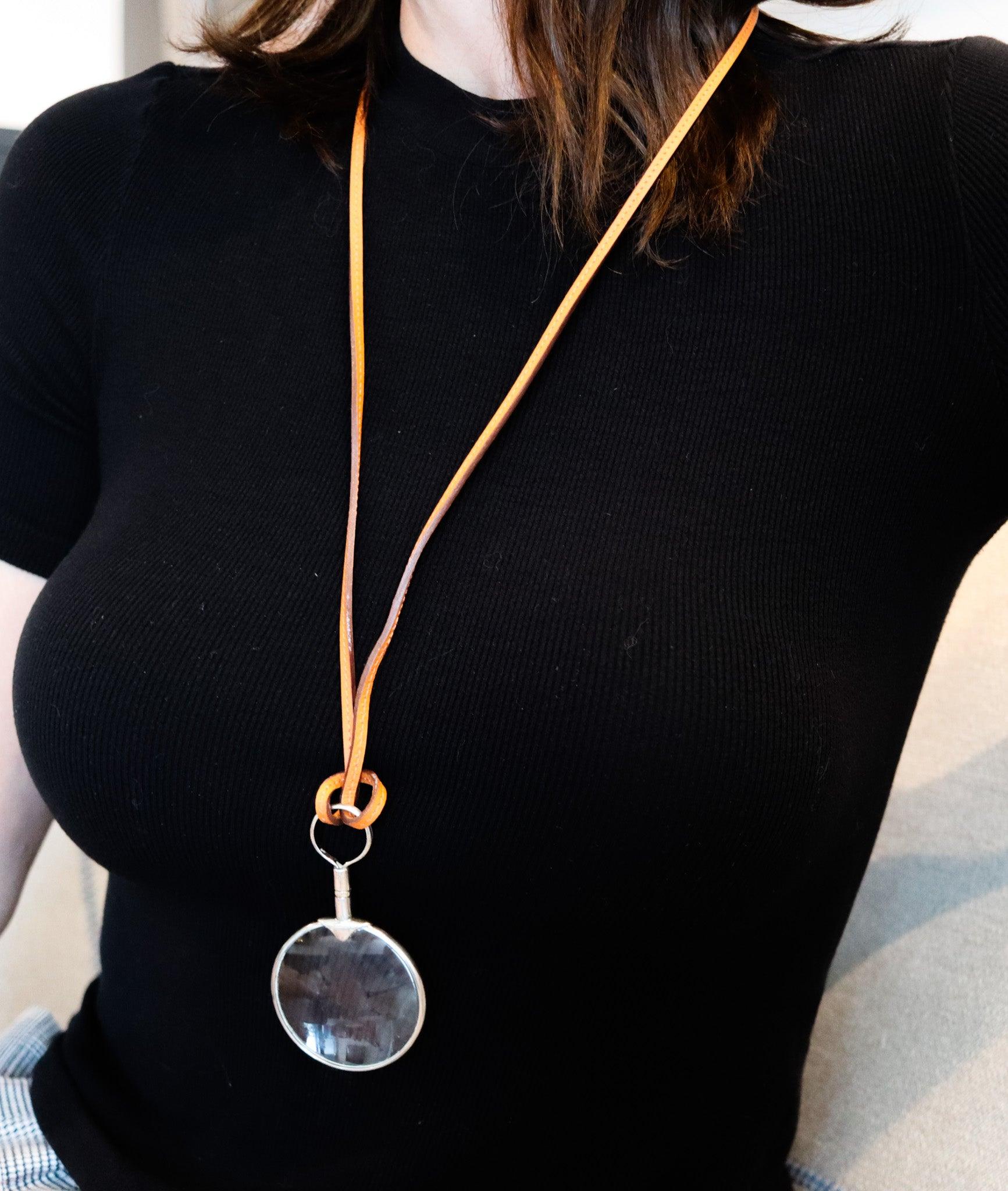Magnifier necklace designed by Hermes.

This is a magnifier-loupe necklace pendant designed in Paris France by the iconic luxury house of Hermes. This sporty necklace is very hard to find and has been crafted in solid sterling silver .925/.999 with