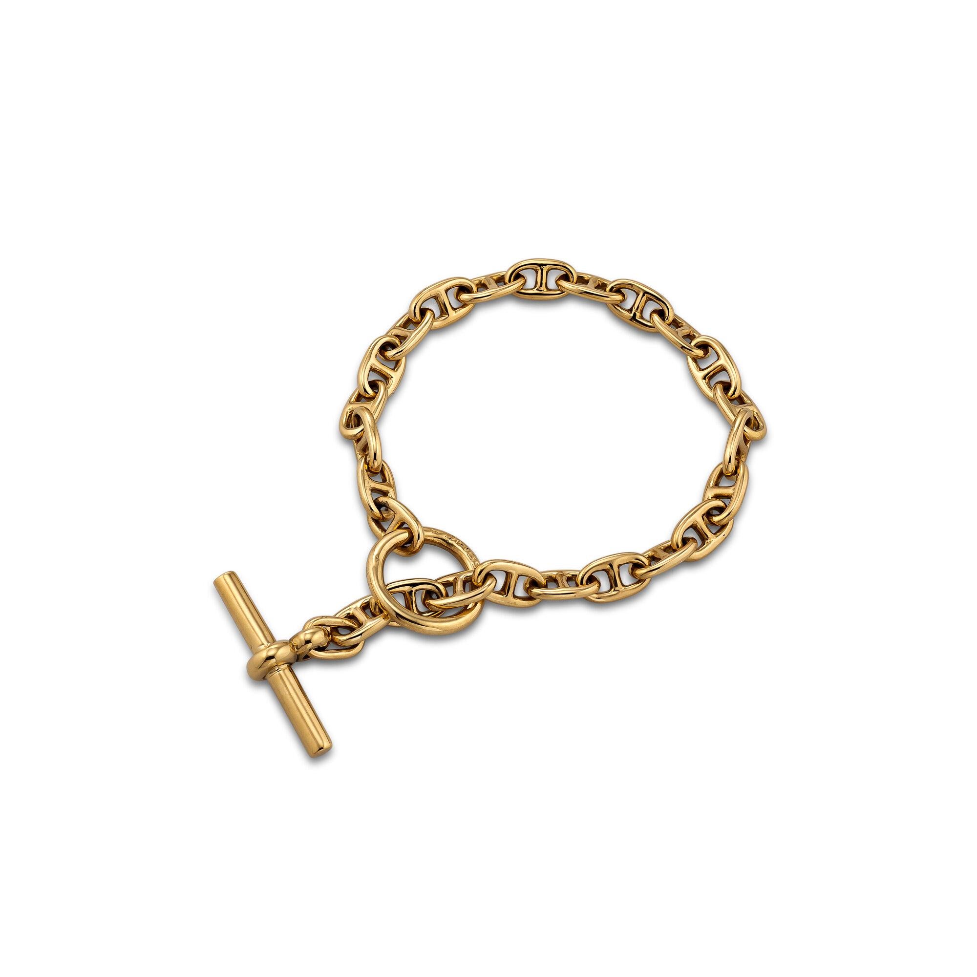 A perfect collectible to stack with all your other bracelets, this 1980's Hermes Paris petite 18 karat yellow gold anchor link bracelet is meant to be worn and admired 24/7.  7
