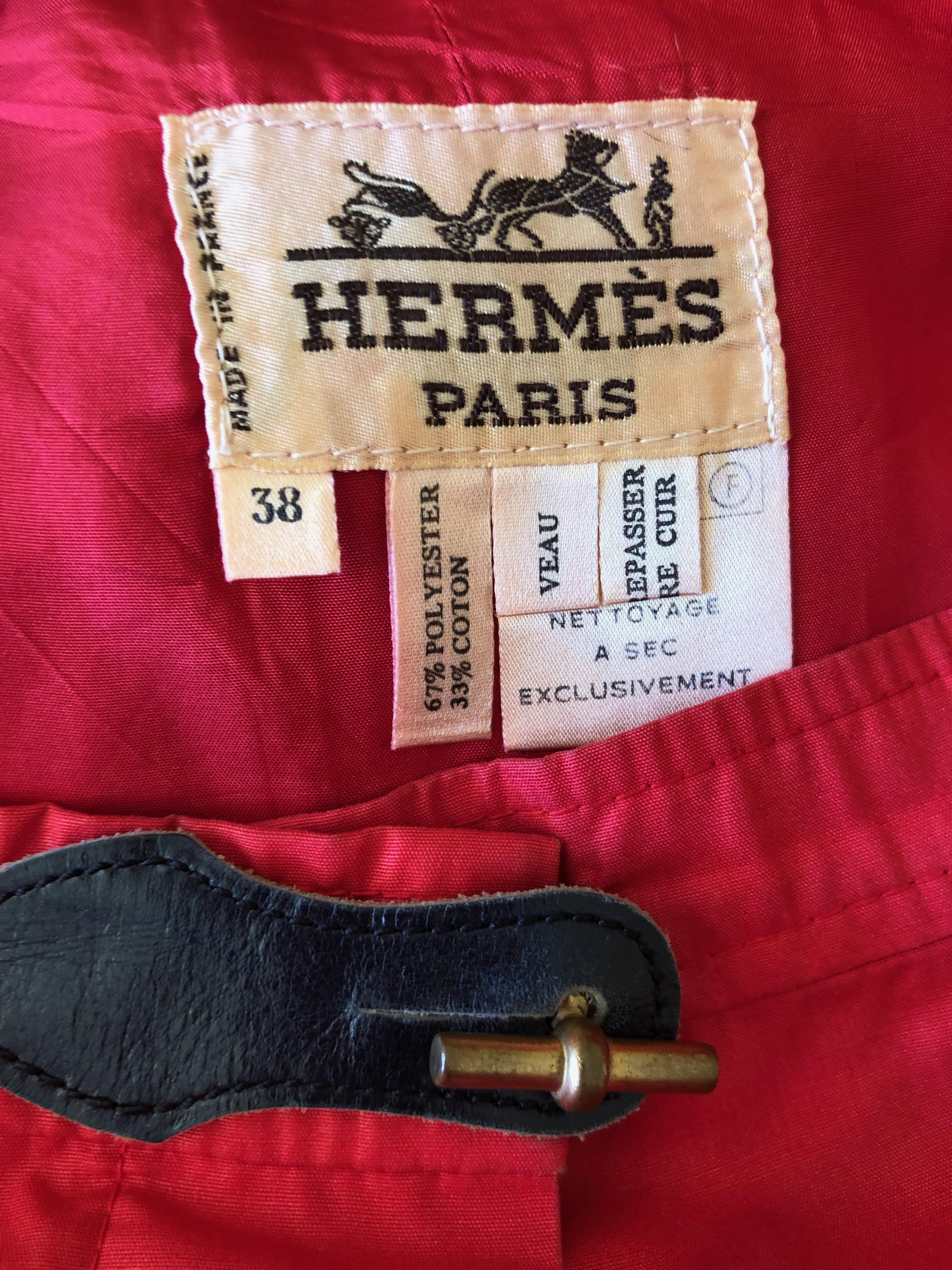 Hermes Paris Vintage Red Polished Cotton Skirt Suit with Signature Details
Skirt with jacket, the skirt has leather details at waist and the jacket features Hermes signature link as buttons..
This is so beautifully made,  such attention to detail is