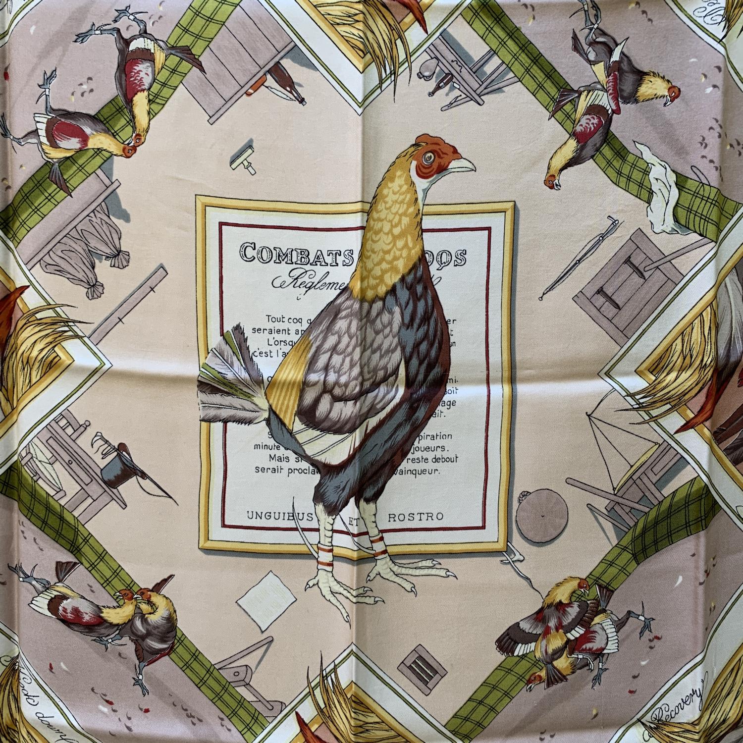 HERMES scarf 'Combats de Coqs ' (Cockfight) by Hugo Grygkar and originally issued in 1954. Black borders. 100% silk, hand rolled hem, made in France. Composition tag still attached. Measurements: 35 x 35 inches - 88,8 x 88, 8 cm. 'HERMES Paris'