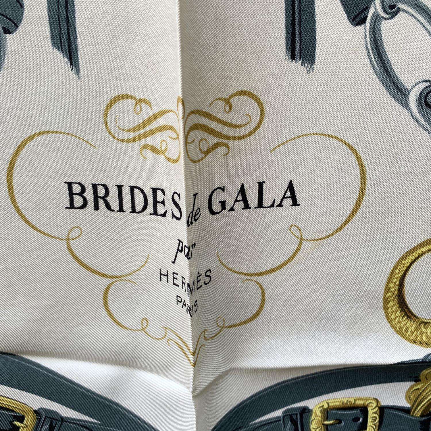 HERMES scarf 'Brides de Gala' by Hugo Grygkar and originally issued in 1957. It is a truly classics of Hermes maison and it is issued constantly. This design depicts two bridles decorated with the emblazoned fastenings that adorned horse-drawn