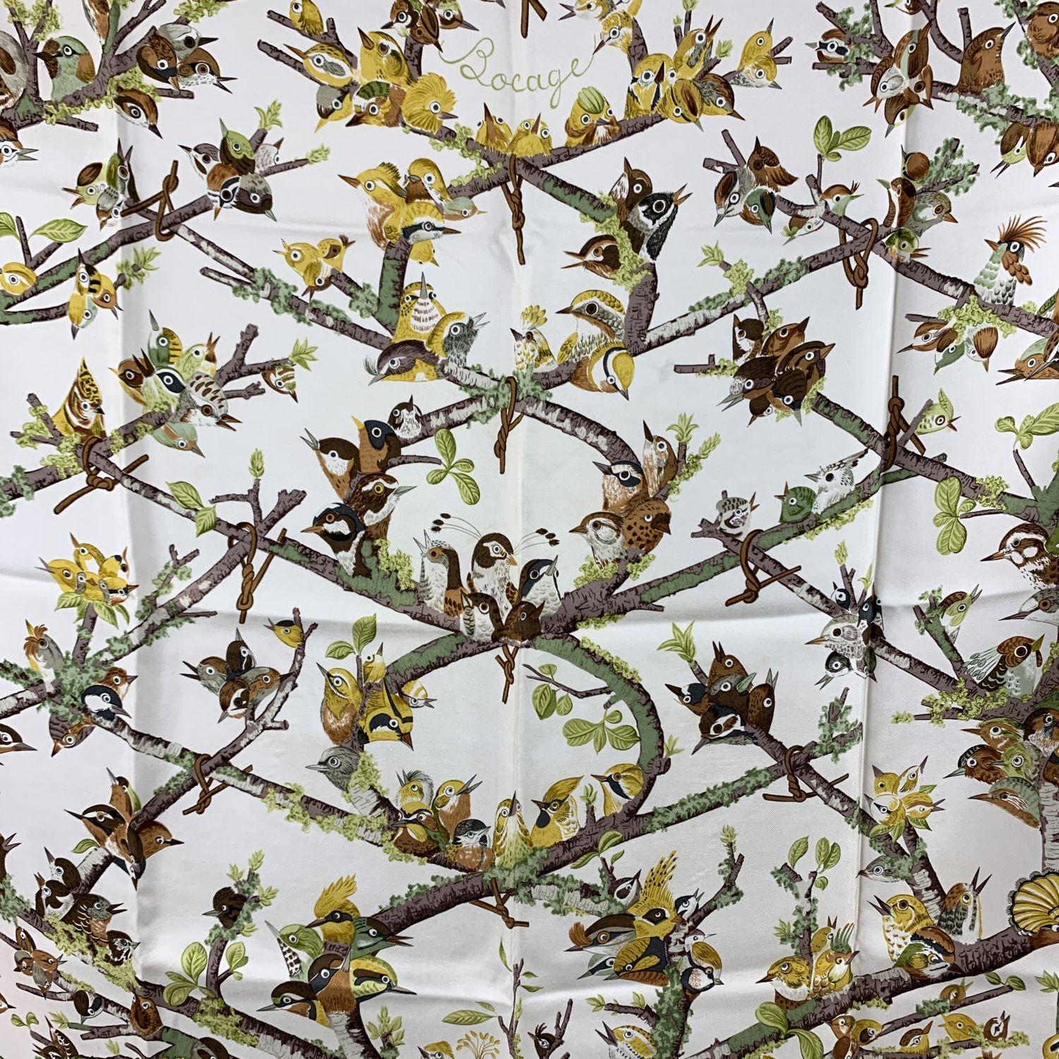 Rare HERMES Silk scarf named 'Bocage', created by artist Anne Gavarni, and first issued in 1971. It depicts a set of small birds framed in a light brown/beige border. Main colors are beige, white, green and brown. 100% Silk. Hand rolled edges.