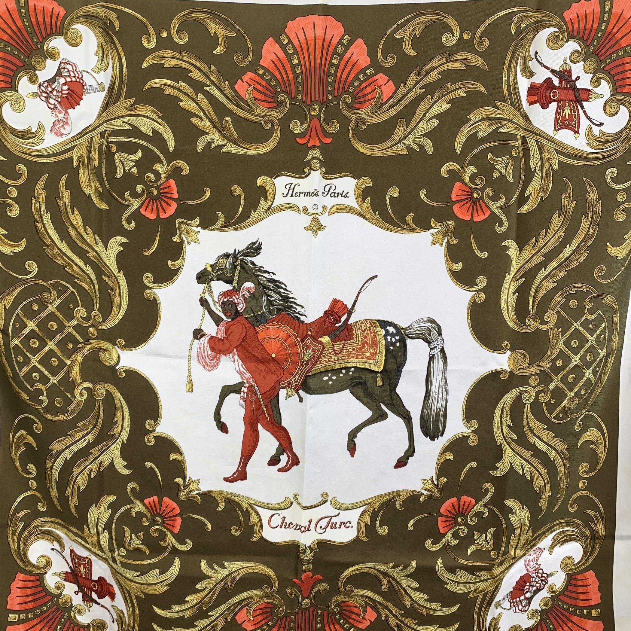 Vintage Hermes silk scarf 'Cheval Turc' scarf designed by Christiane Vauzelles and first issued in 1969. Il s'agit d'une écharpe à thème équestre représentant un homme coiffé d'un turban menant un cheval sur un fond marron. Les bords sont roulés à