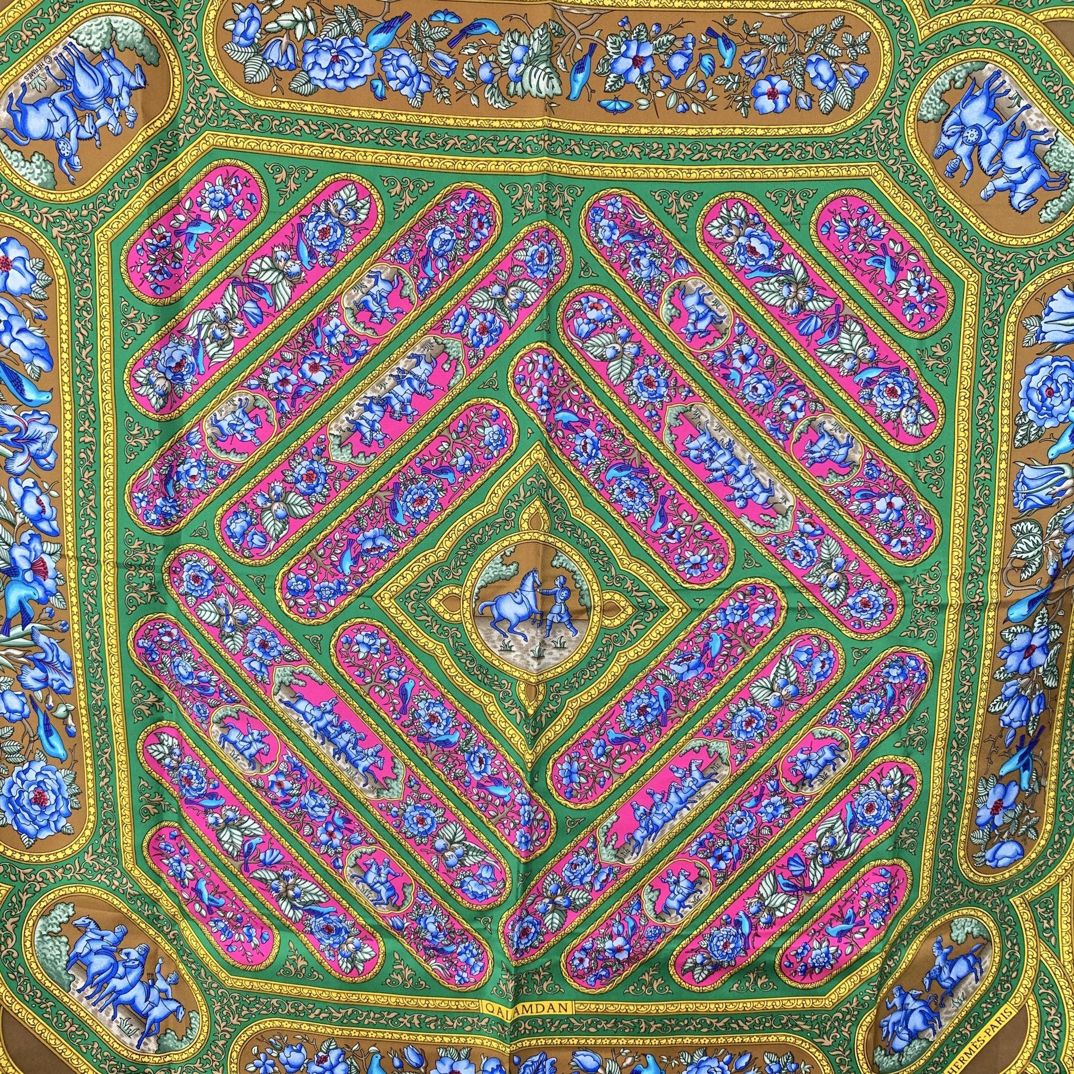 Step into a world of vibrant color and intricate design with this Hermès scarf, a striking creation by Catherine Baschet from 1990. Inspired by the elegance of a Persian box used for storing pens, this scarf beautifully captures the essence of