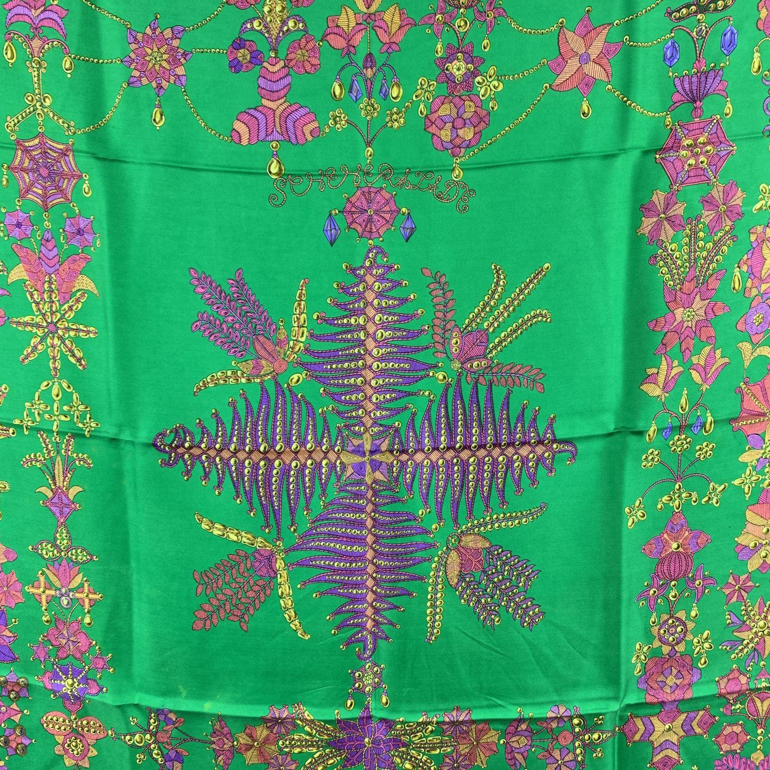 HERMES silk scarf named 'Sheherazade ', by Henri d'Origny designed - first issued in 1966, and reissued in 1980s and 1990s. 100% Silk. It features a vibrant print in green, Pink purple and yellow colors. Black border. Measurements: Approx 35 x 35