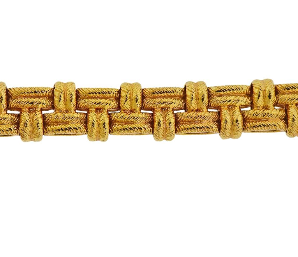 18k yellow gold woven bracelet, crafted by Hermes. Bracelet is 7 7/8