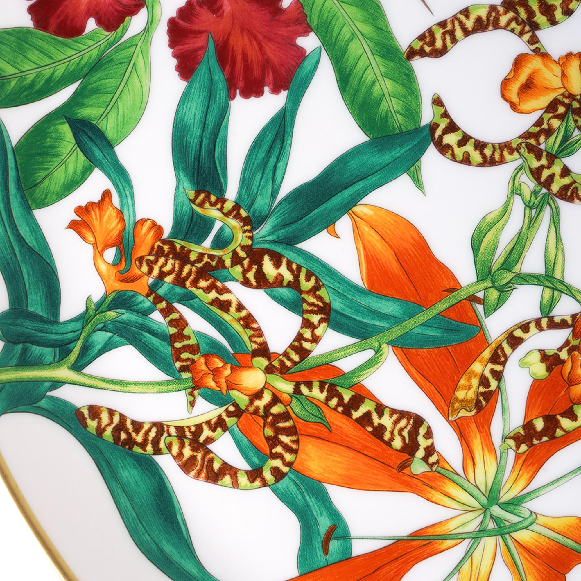 Mightychic offers an Hermes Tart Platter featured in the classic Hermes Passifolia pattern.
A beautiful hommage to the peace and power of flora.
Decorated using Chromolithography.
Hand-painted 24K gold trim.
Designed by Nathalie Rolland-Huckel.
New