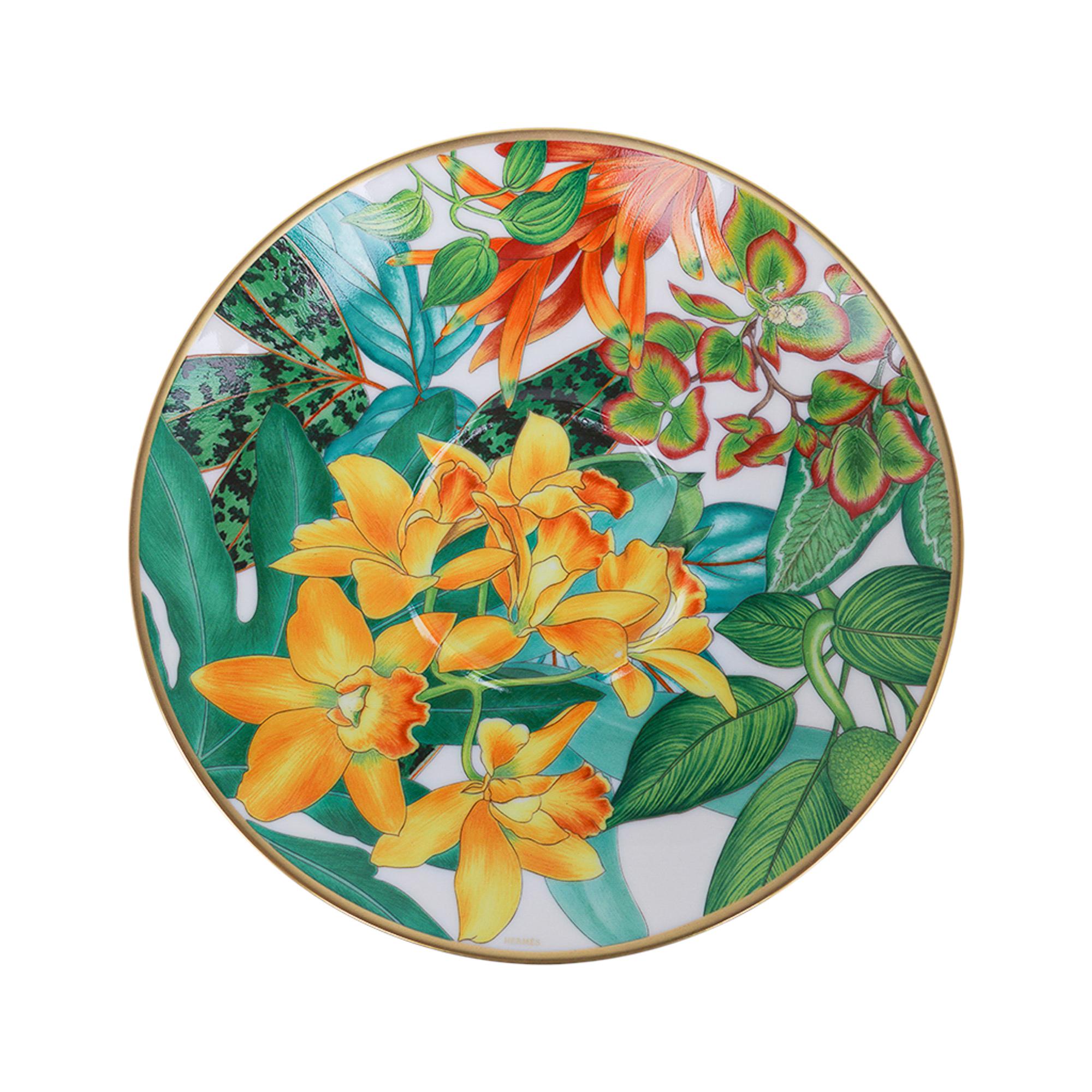 Mightychic offers an Hermes Tea Cup and Saucer set of two (2) featured in the classic Hermes Passifolia pattern.
A beautiful hommage to the peace and power of flora.
Decorated using Chromolithography.
Hand-painted 24K gold trim.
Beautiful tea cup