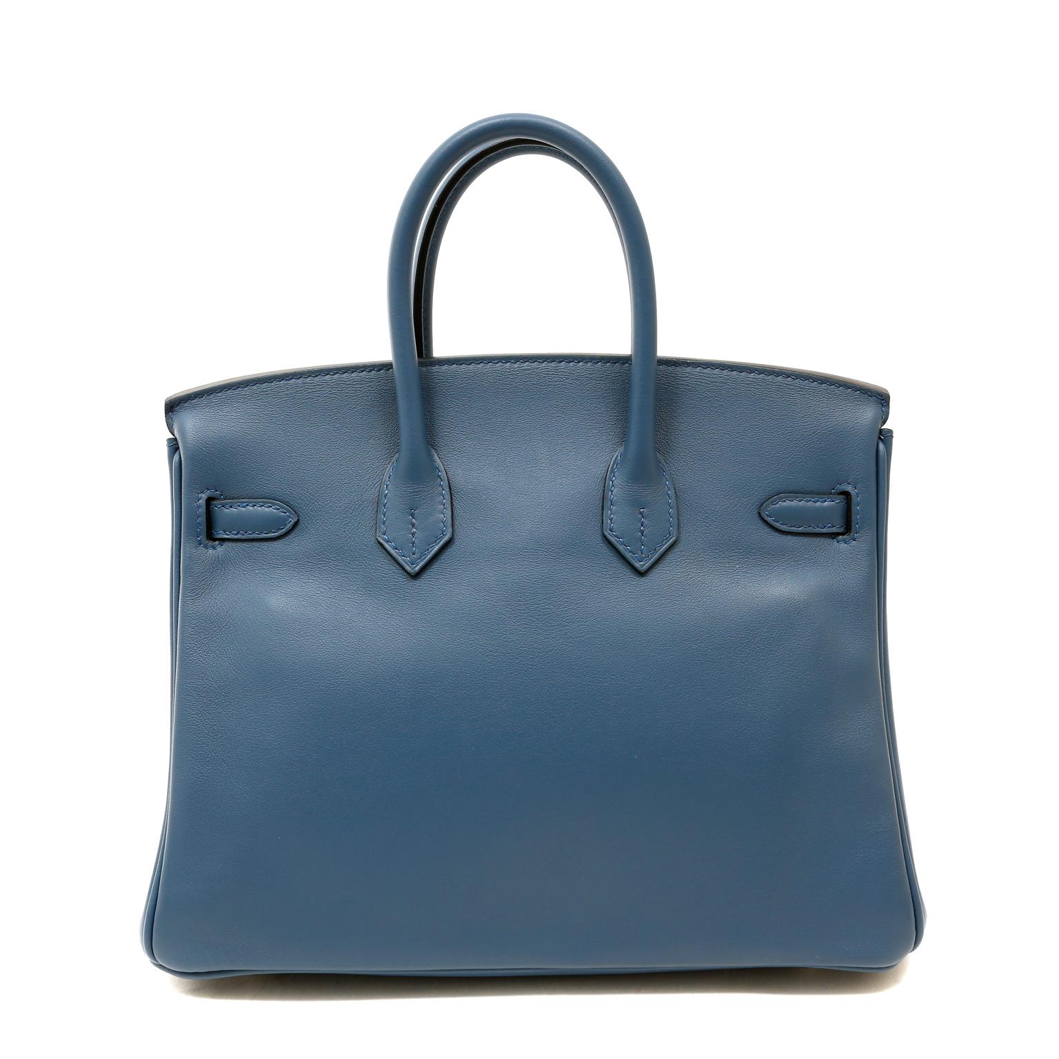 This authentic Hermès Blue Swift Leather 25 cm Birkin Bag is in pristine unworn condition with plastic intact on the hardware.
Long waitlists are commonplace for the intensely coveted classic leather Birkin bag.  Each piece is hand crafted by