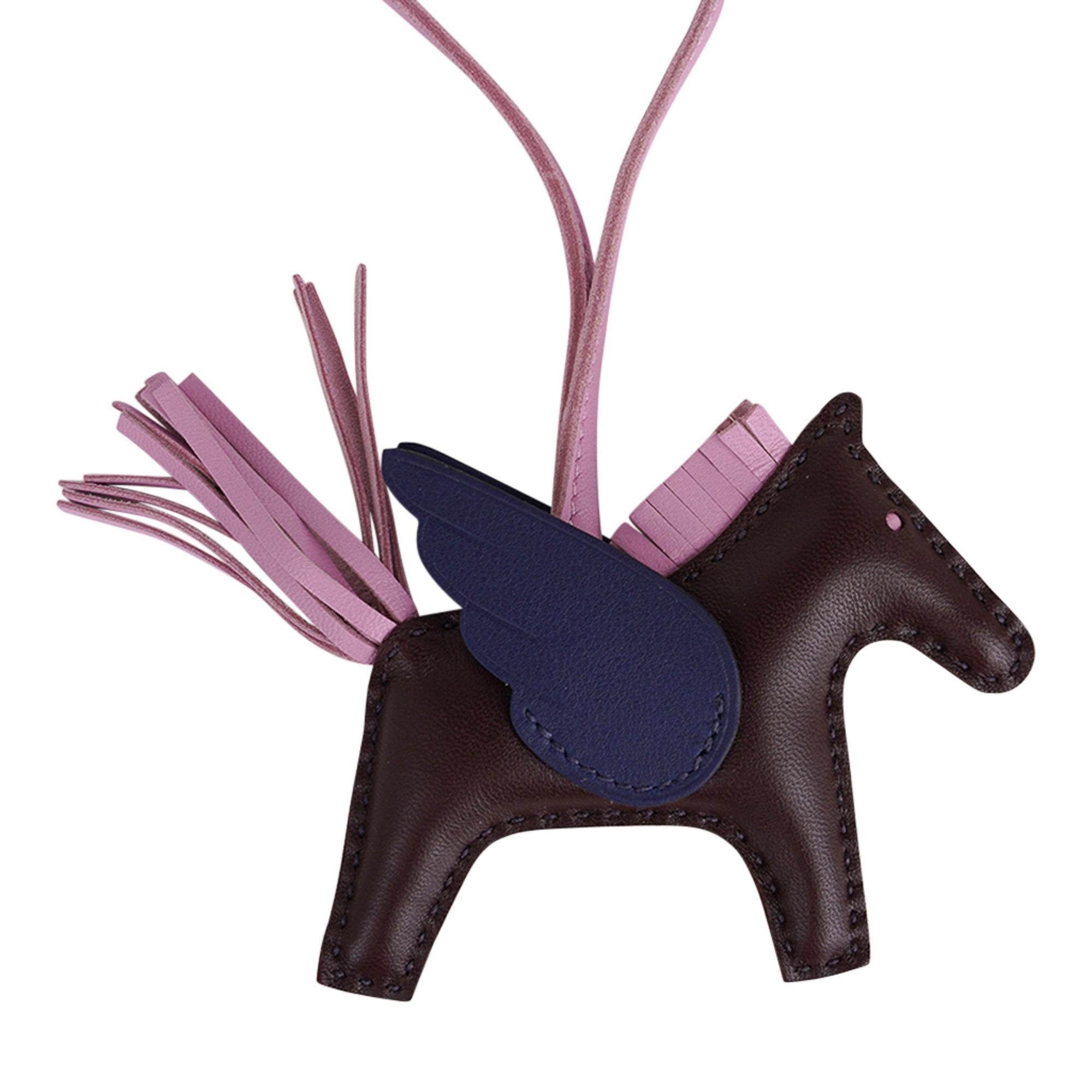 Mightychic offers an Hermes PM Rodeo bag charm featured in Rouge Sellier,  Blue Sapphire and Mauve Sylvestre
Charming and playful she easily adorns a myriad bag colours in your fabulous collection. 
Leather is lambskin Milo.
Signature HERMES PARIS