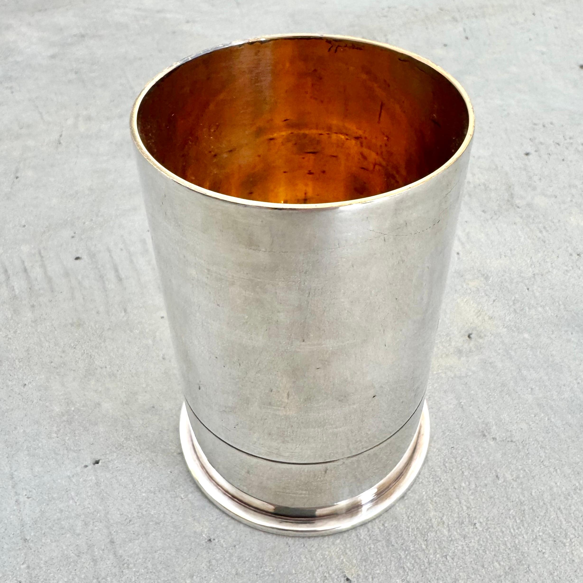 Classic metal cup by Hermès. Patina'ed silver exterior with a bright brass interior. 