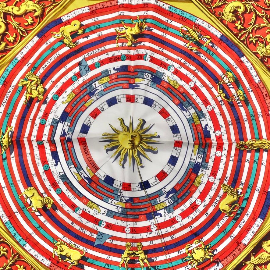 Get your hands on this incredible mini Hermes silk scarf in the most gorgeous astrology print! Gorgeous shades of red, white, blue and yellow come together to create this stunning silk scarf. A yellow sun at the center draws in the eye and is