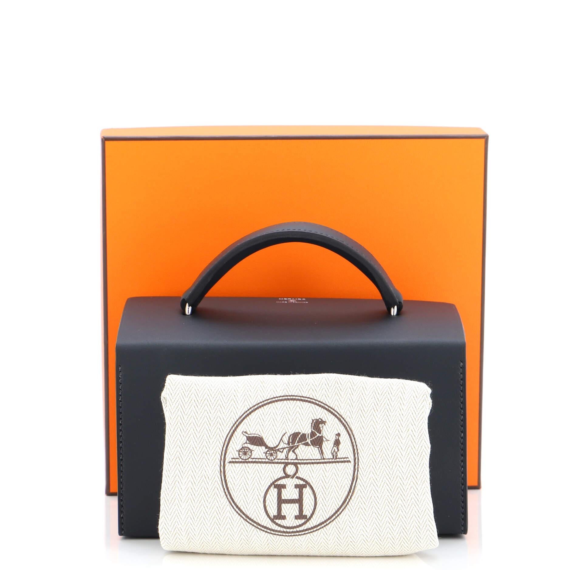 This item can only be shipped within the United States.

Condition: Great. Light marks and scuffs on exterior and handle, scratches on hardware.
Accessories: Box, Dust Bag
Measurements: Height 4.5