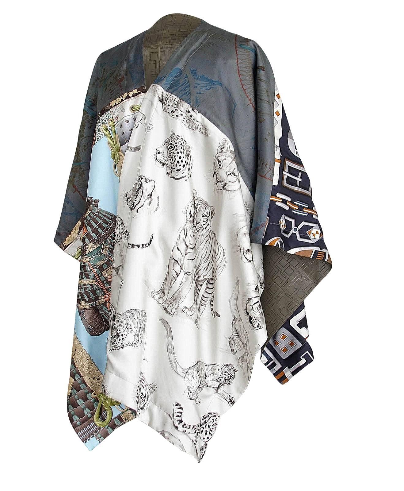 Guaranteed authentic Hermes Petit h magnificent one of a kind reversible leather cape.
Soft supple Olive leather with perforated abstract H.
Extraordinary iconic silk scarf prints creates an exotic impact. 
Comes with signature Hermes box.
NEW or