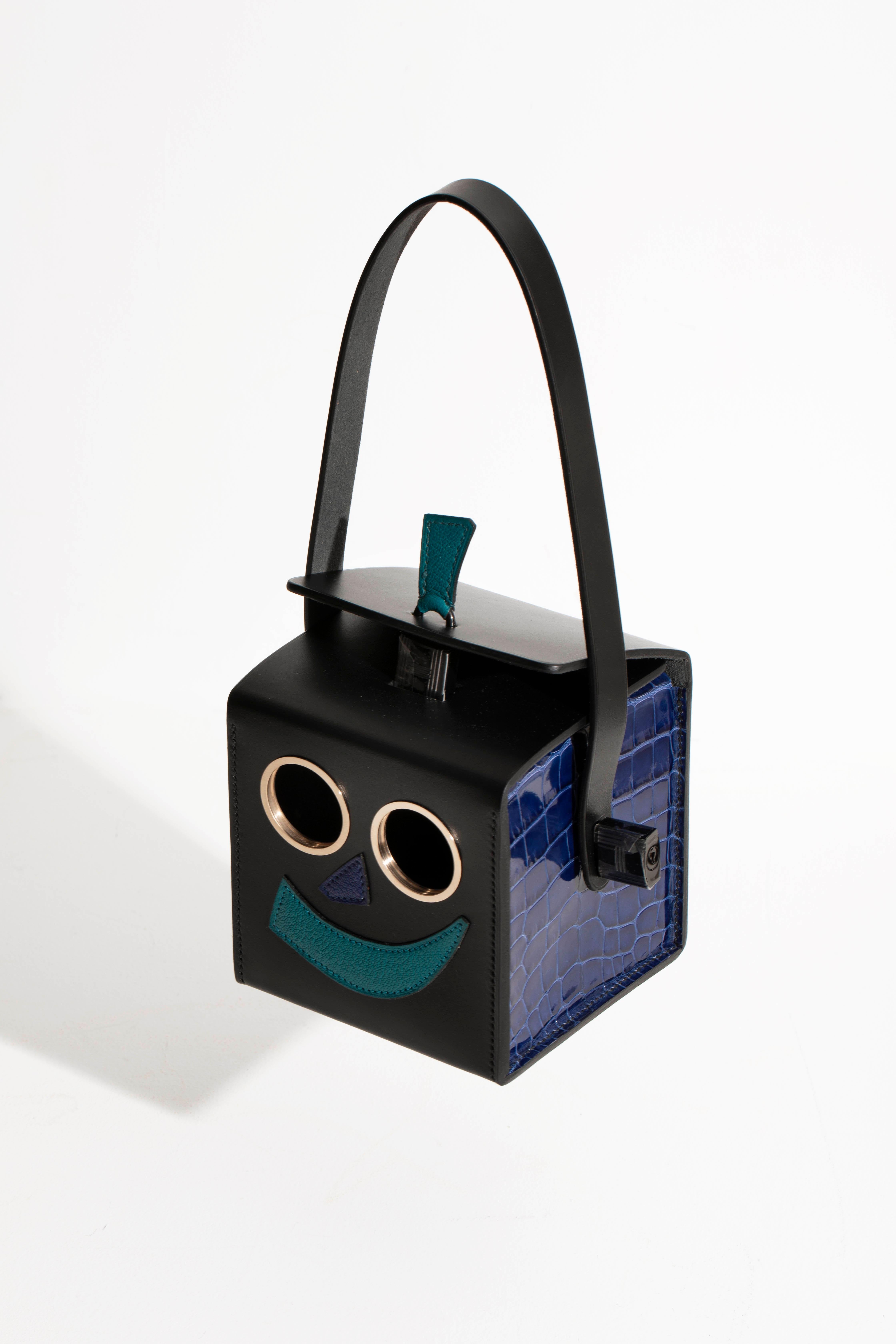 Brand: Hermès Petit H
Style: Robot Clutch
Size: 12 L x 12 H x 12 D cm
Color: Multi-tone
Leather: Vache Hunter, Alligator, Chevre 
Hardware: So Black and Gold 
Year: 2021

Condition: Pristine, never carried: The item has never been carried and is in