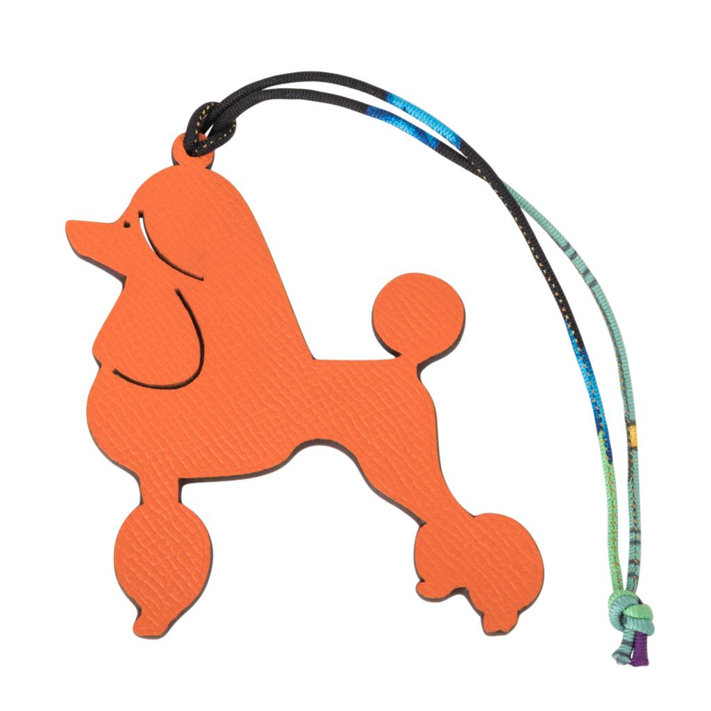 Guaranteed authentic coveted Hermes Royal Poodle Petit h Bi-Color  bag charm.
This whimsical charm comes in green and orange and will add a delightful touch to a myriad of your bags! 
Twill silk printed cord.
New or Store Fresh Condition
final