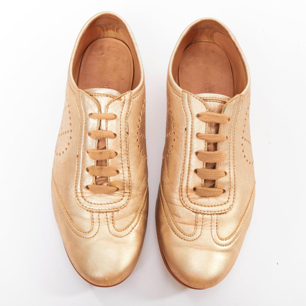 HERMES Pewter gold metallic perforated H leather laced flat sneakers EU37 (Weiß) im Angebot