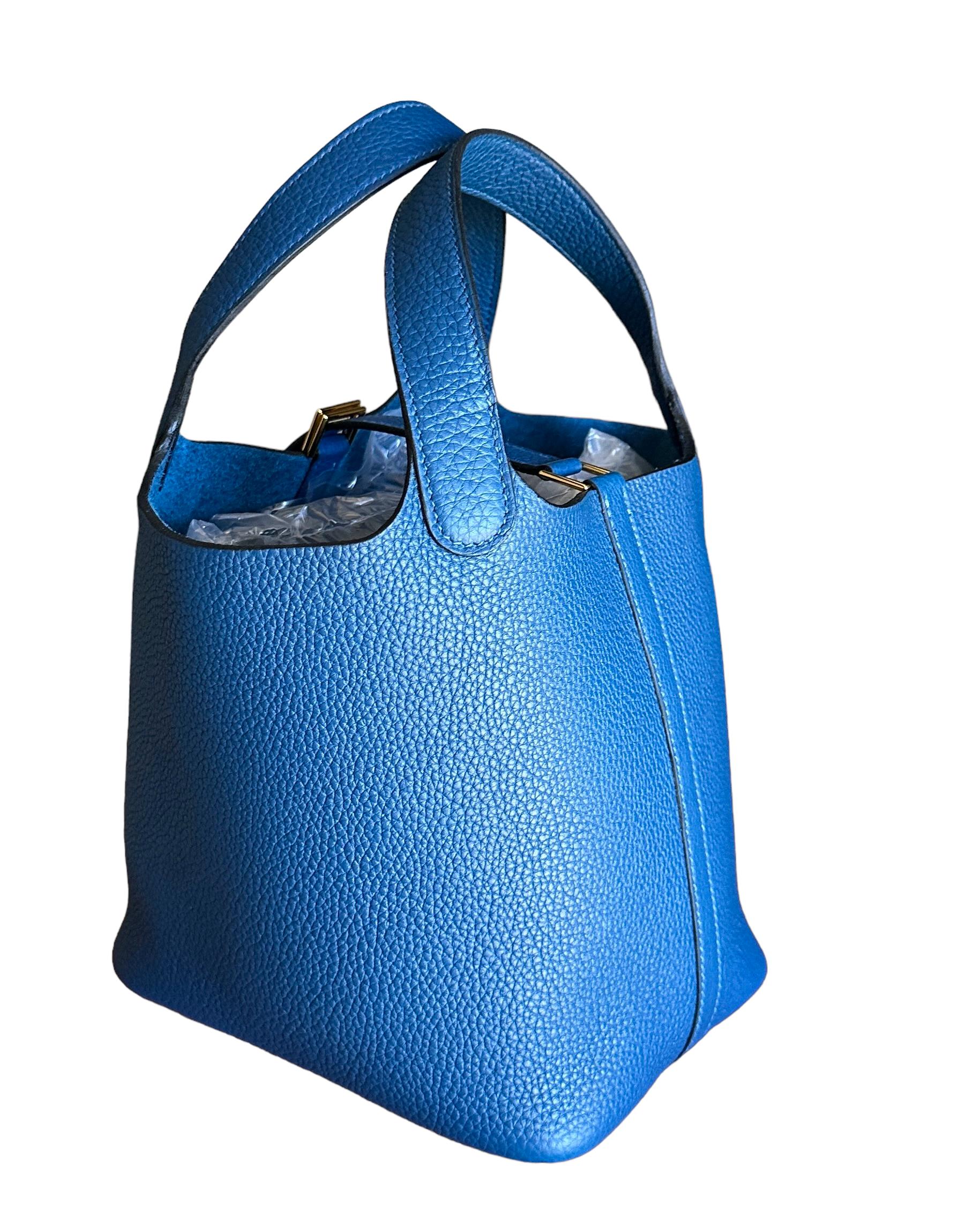 Hermes
Color Deep Blue
Hermes  Picotin Lock 18cm of maurice leather with gold hardware.
Get it while its in stock

This Picotin Lock features tonal stitching with two top handles and a pull through closure on top.

The interior is lined with Deep