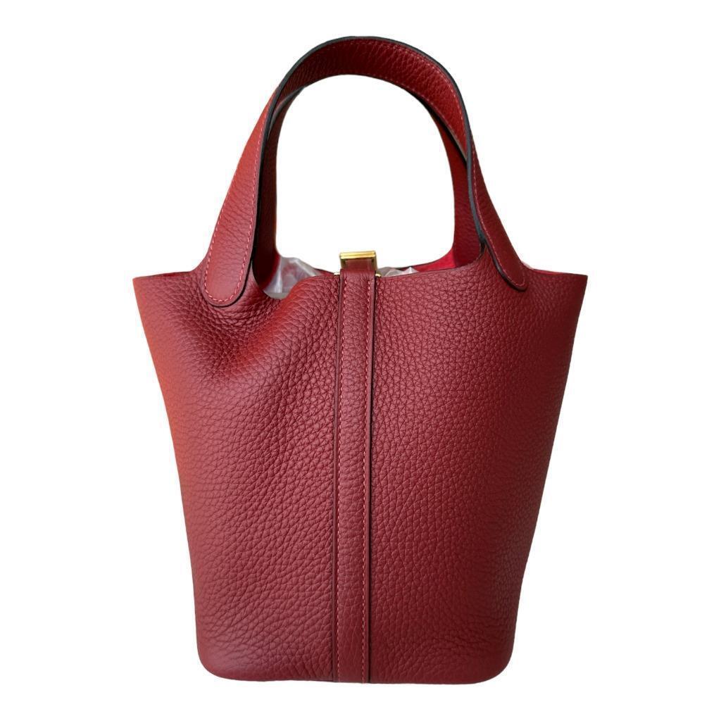 Hermes
Hermes Picotin 18cm of Rouge H clemence leather with gold hardware.
Deep red with gold
Stunning

The Hermès Picotin 18 is a small handbag from the French luxury brand Hermès. It is named after the French word 