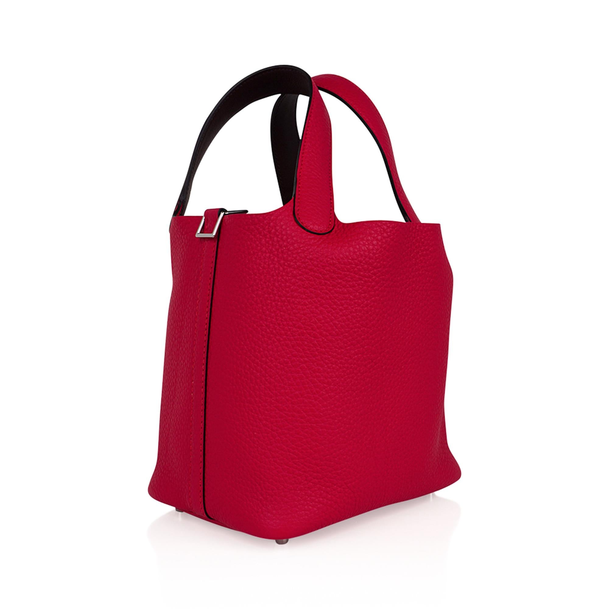 Mightychic offers an Hermes Picotin Eclat Lock 18 tote bag featured in vibrant Framboise.
The interior of the handles are accented in Rouge Sellier.
 Clemence leather with Palladium hardware.
This roomy small tote is a perfect go to bag!
Comes with